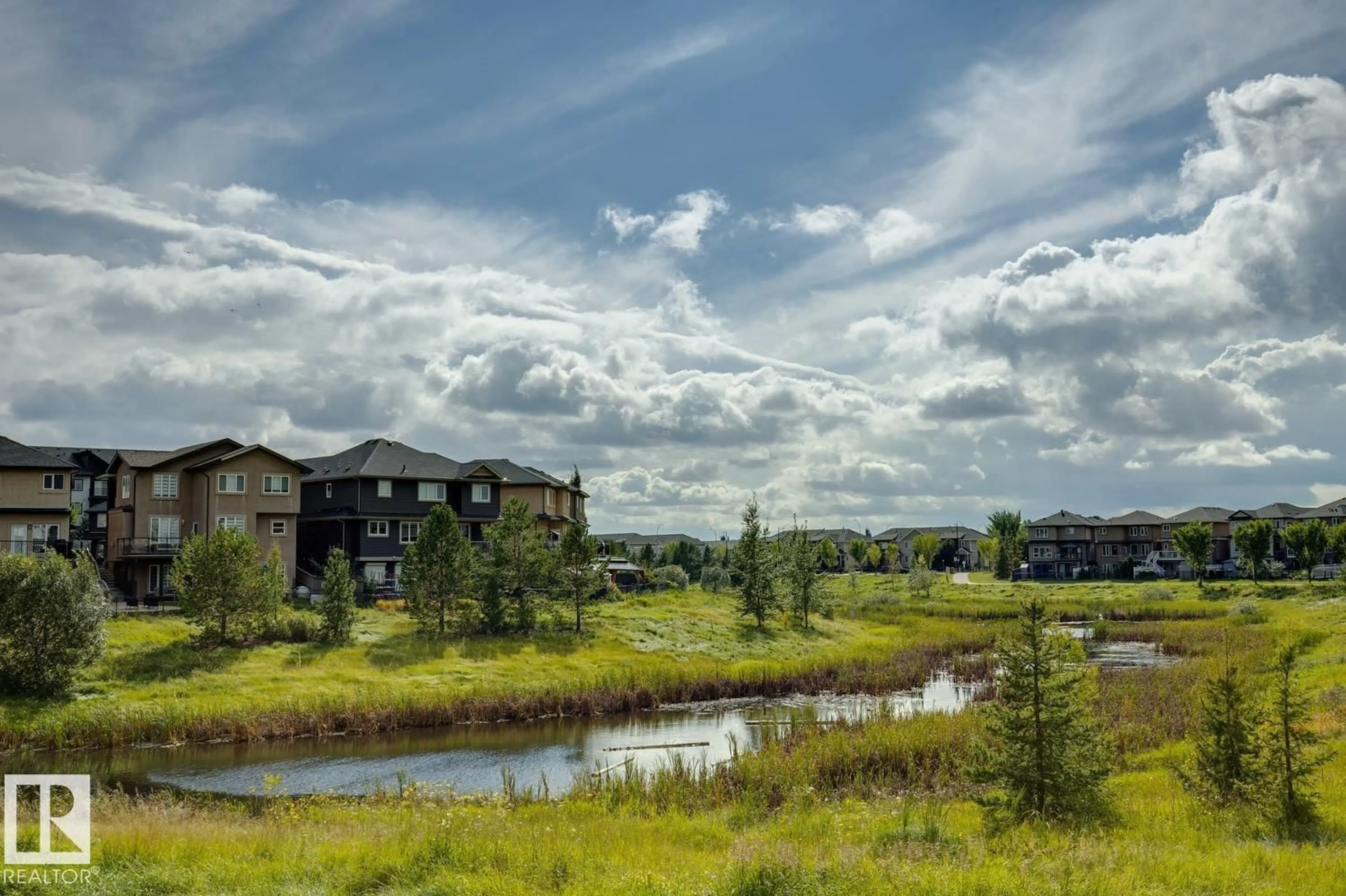 A pic from outside/outdoor area/front of a property/back of a property/a pic from drone, water/lake/river/ocean view for NW - 811 ALBANY COVE, Edmonton Alberta T6V0H3