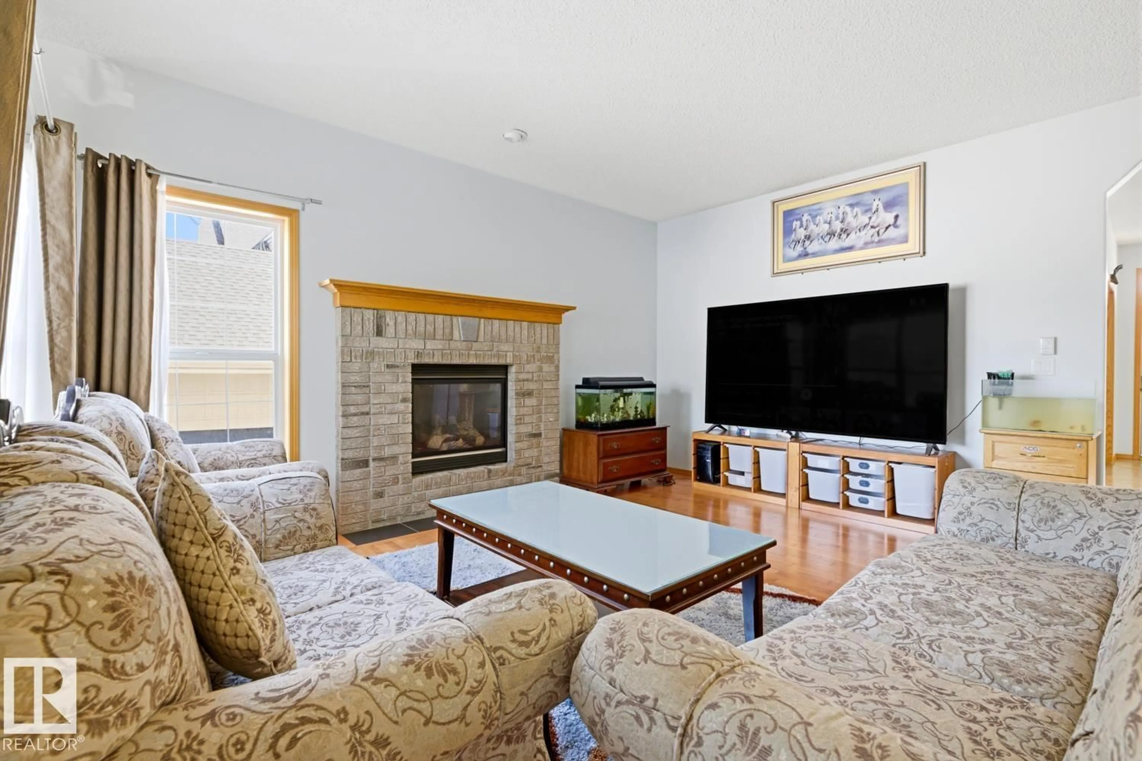 Living room with furniture, unknown for 9904 144 AV, Edmonton Alberta T5E6M5