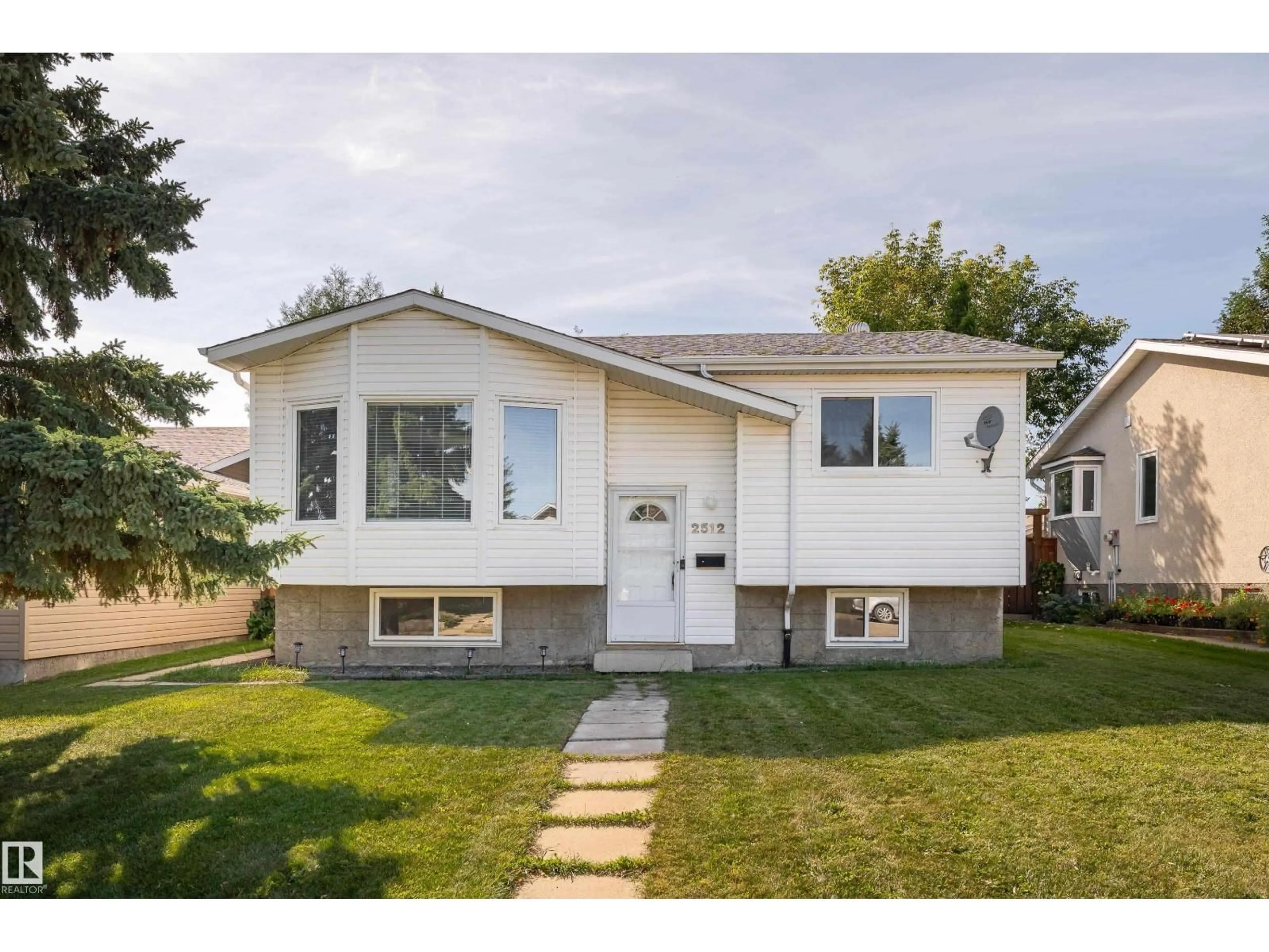 Home with vinyl exterior material, street for 2512 46A ST, Edmonton Alberta T6L3X8