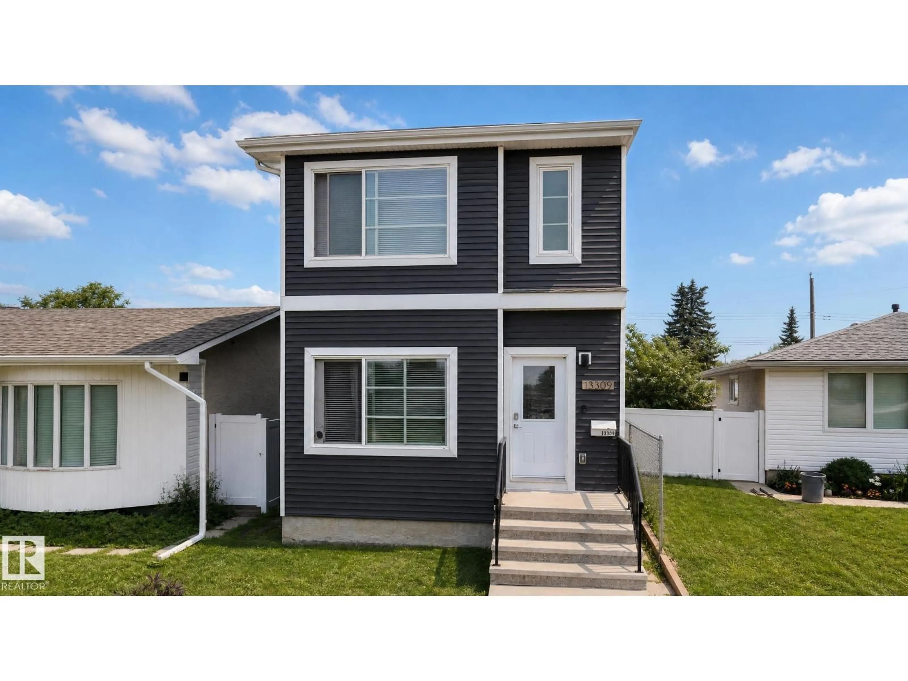 Home with vinyl exterior material, street for 13309 128 ST, Edmonton Alberta T5L1E7