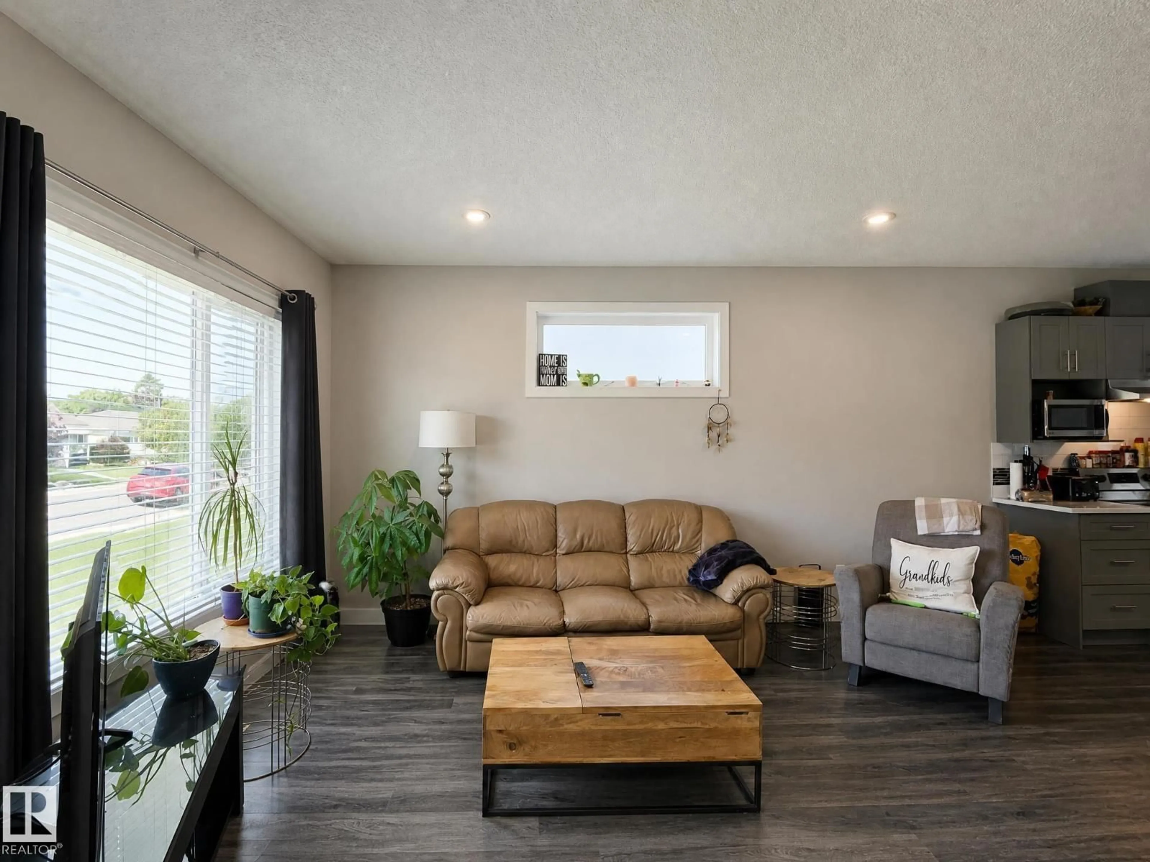 Living room with furniture, wood/laminate floor for 13309 128 ST, Edmonton Alberta T5L1E7