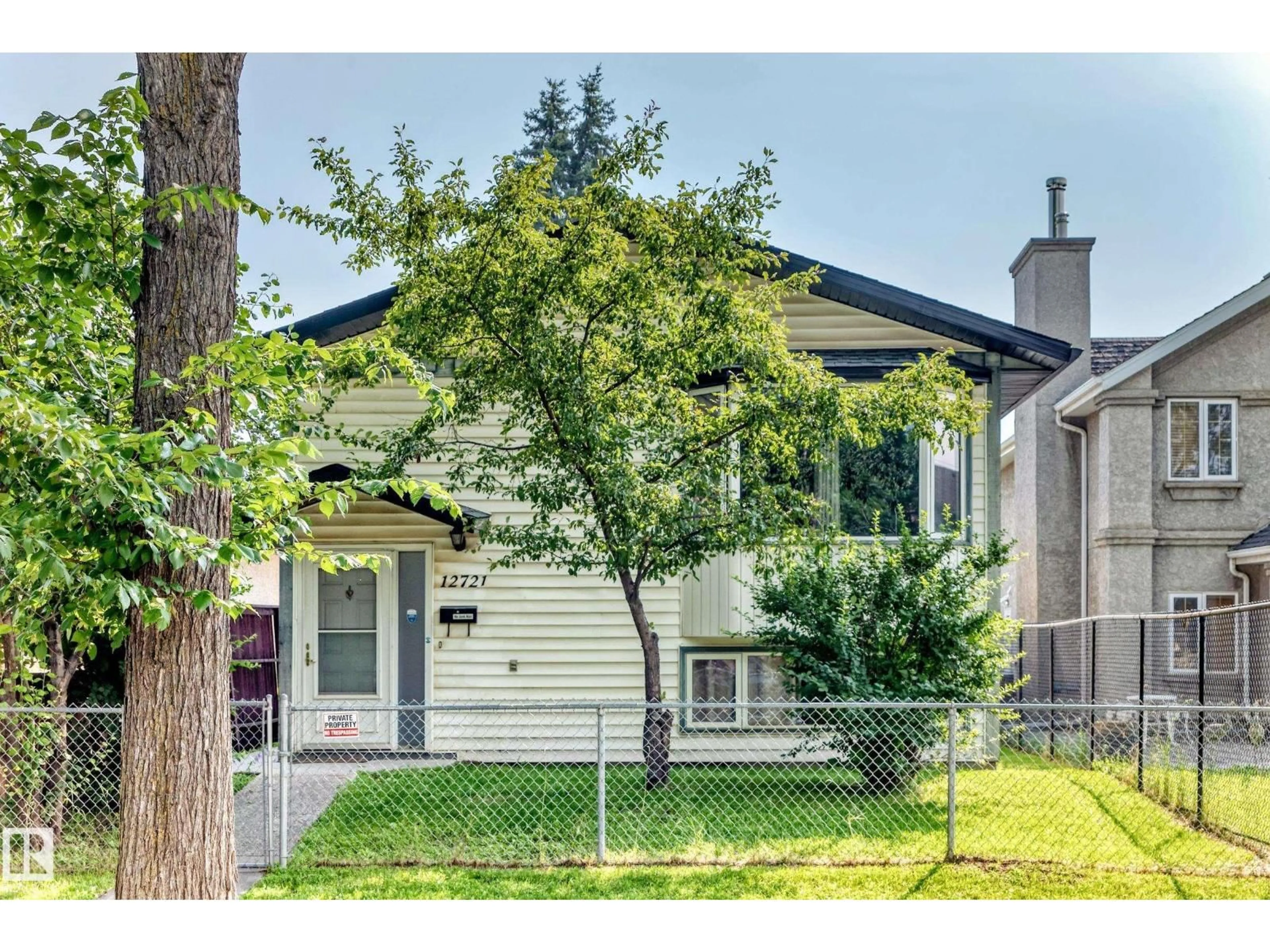 Home with vinyl exterior material, street for NW - 12721 117 ST, Edmonton Alberta T5E5J6