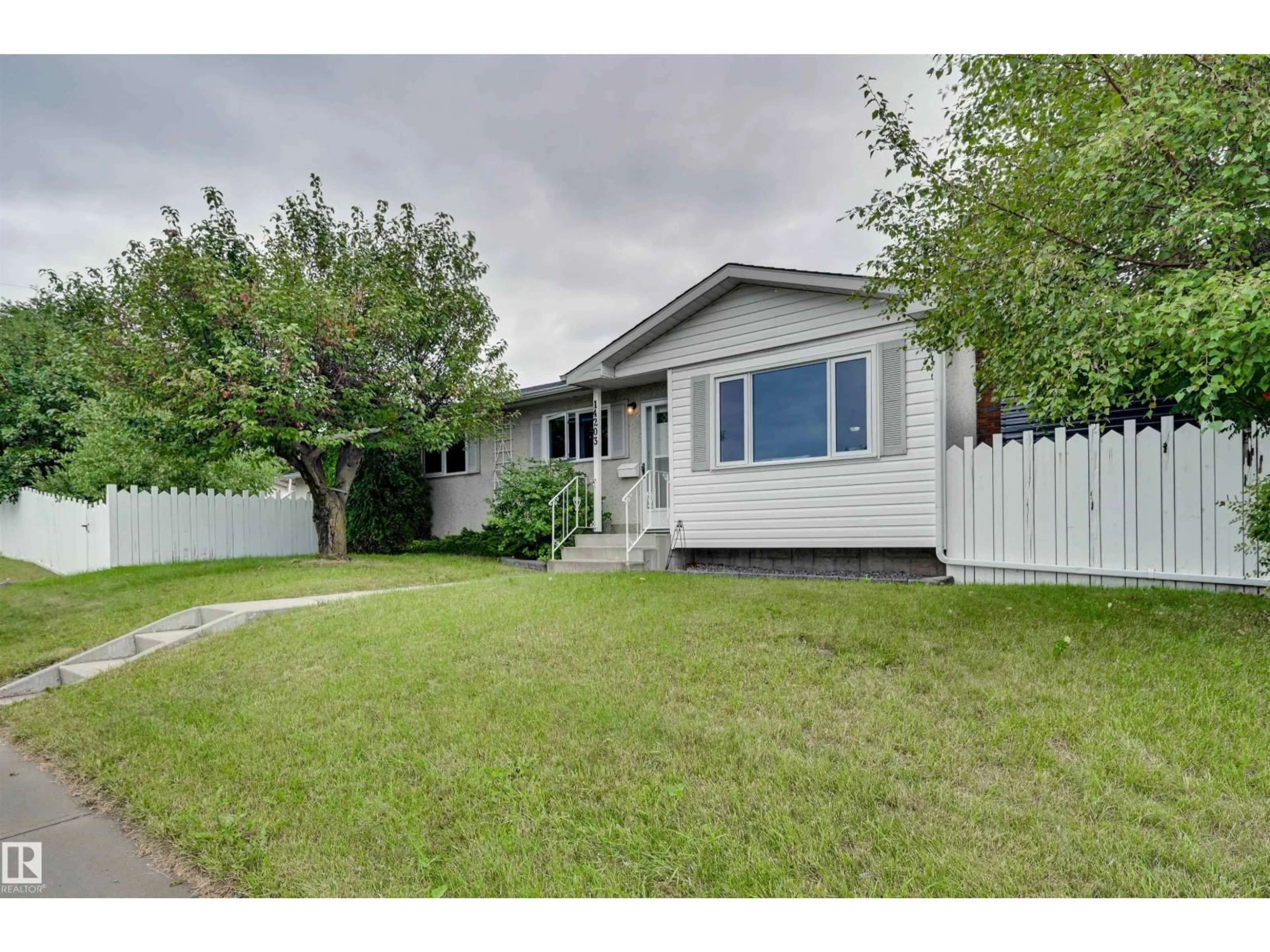 Home with vinyl exterior material, street for 14203 61 ST, Edmonton Alberta T5A1P4