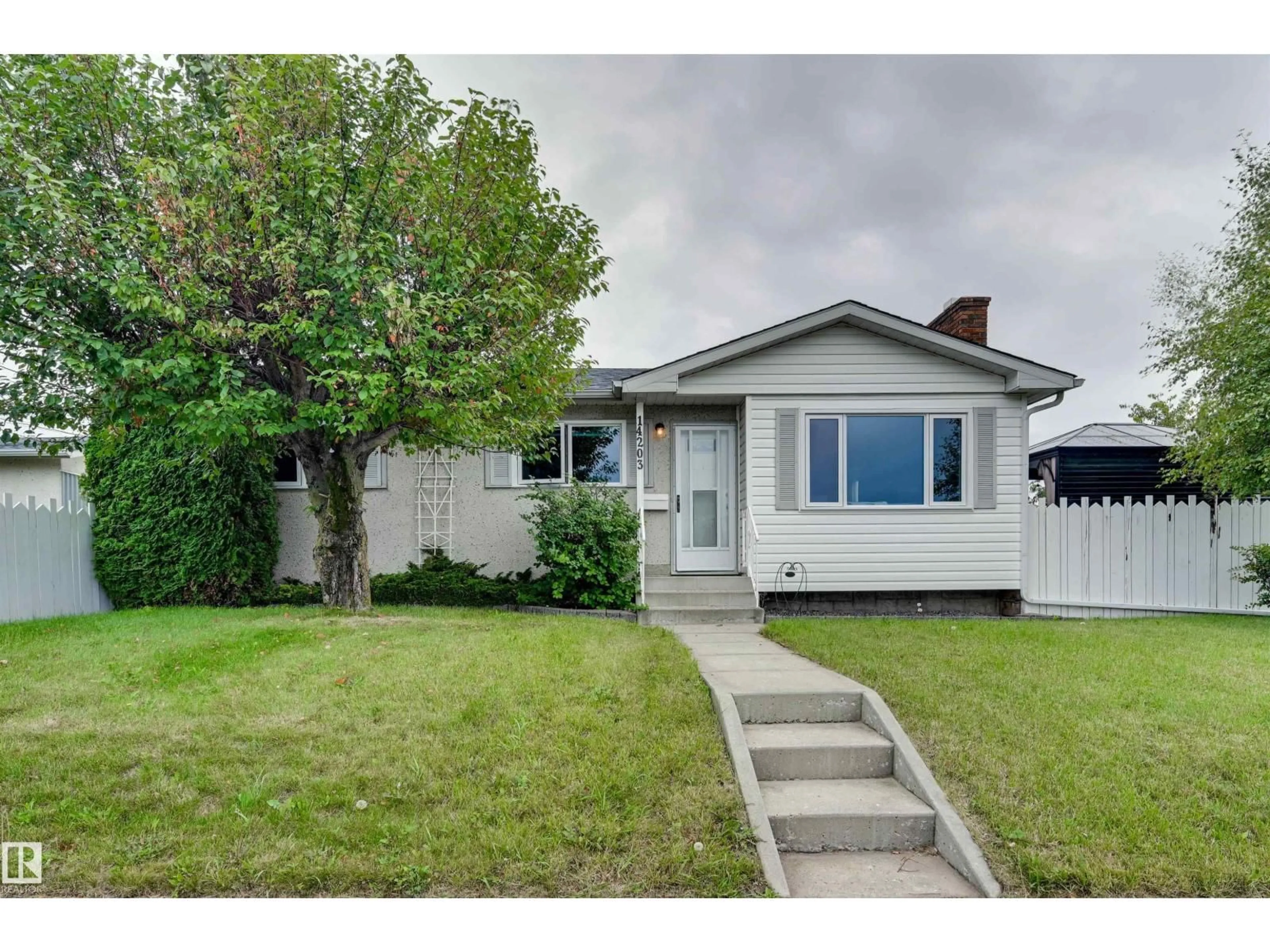 Home with vinyl exterior material, street for 14203 61 ST, Edmonton Alberta T5A1P4