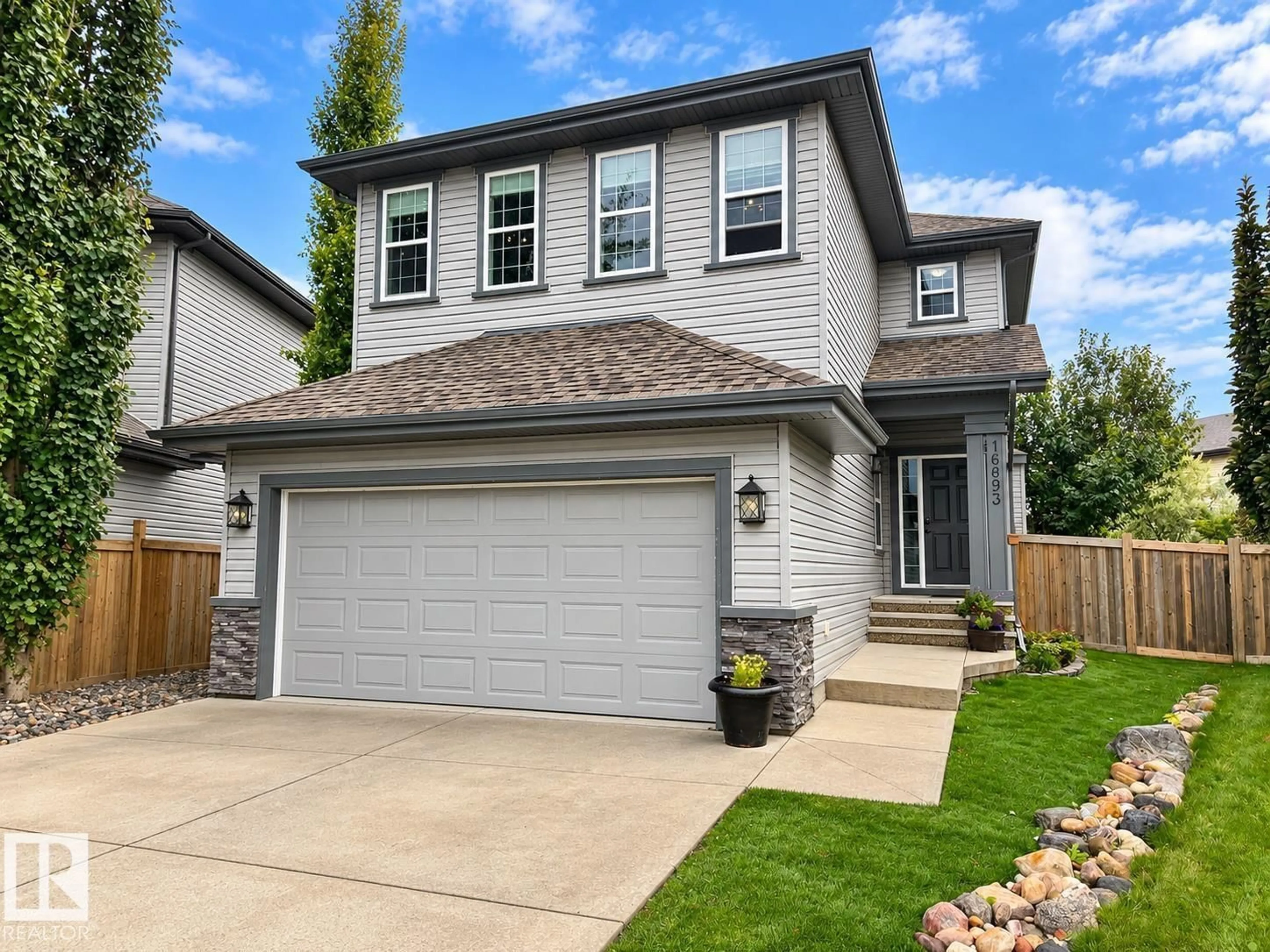 Home with vinyl exterior material, street for 16893 58A ST, Edmonton Alberta T5Y0N1