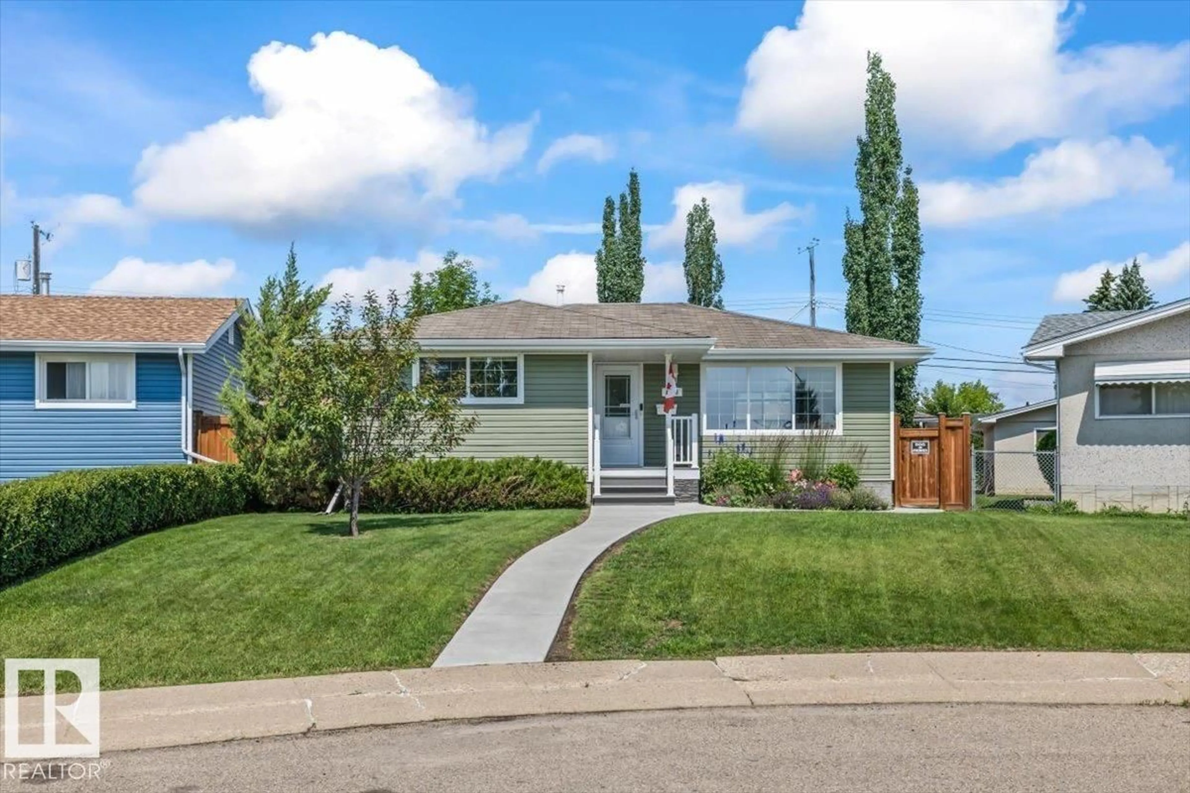 Home with vinyl exterior material, street for 7408 133 AV, Edmonton Alberta T5C2E4
