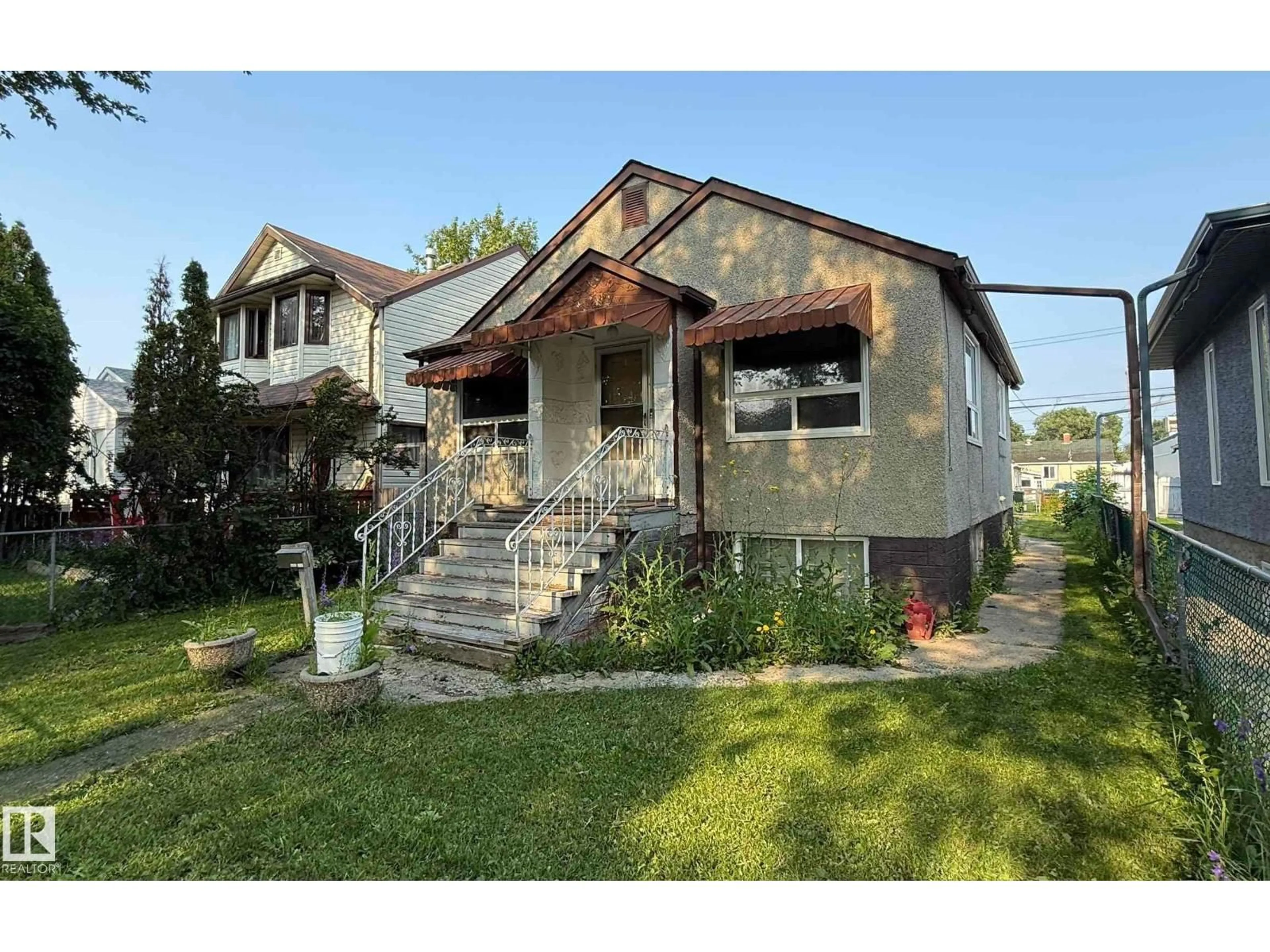 Home with brick exterior material, street for 11825 67 ST, Edmonton Alberta T5B1L9