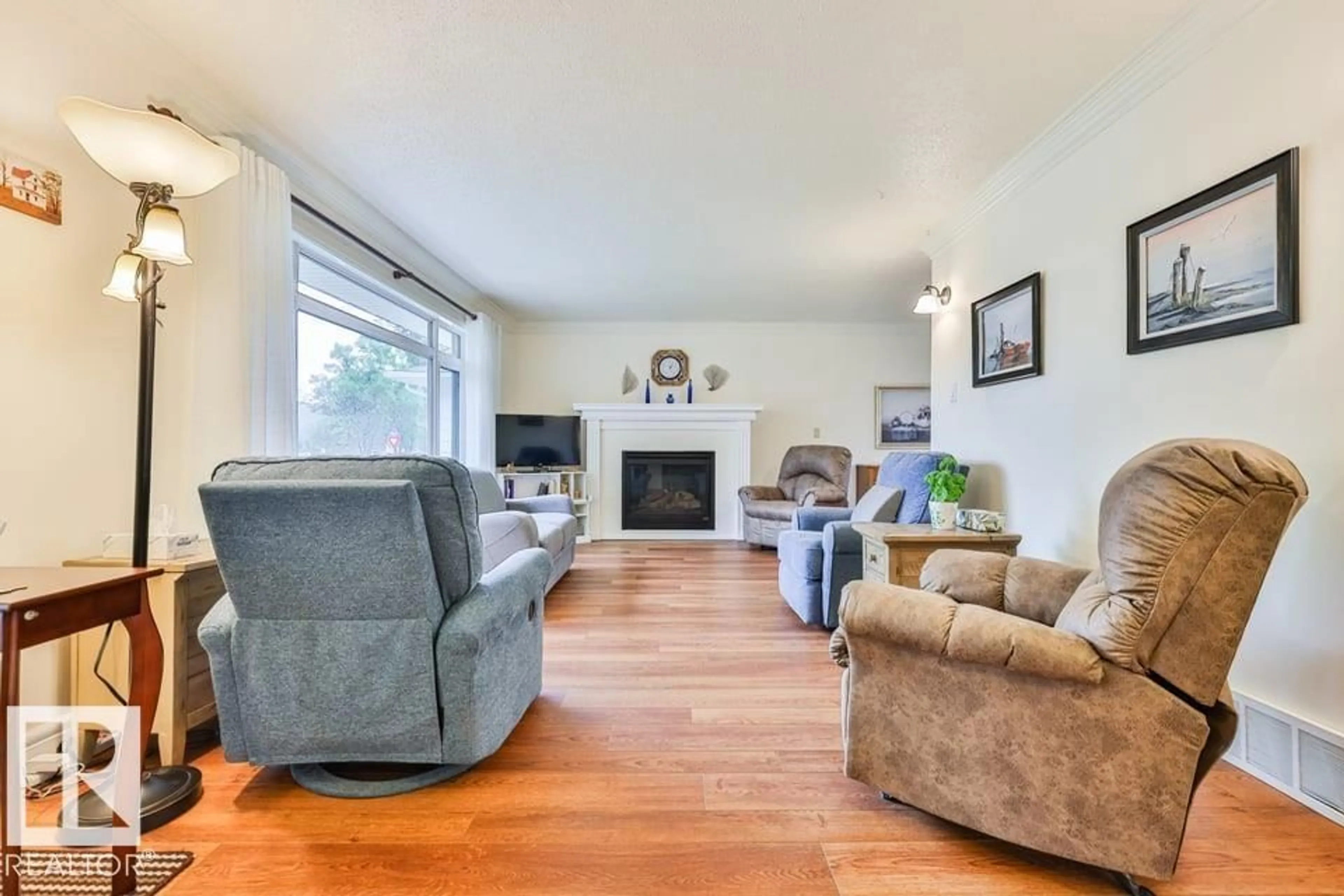 Living room with furniture, wood/laminate floor for 5203 48 AV, Leduc Alberta T9E5E6