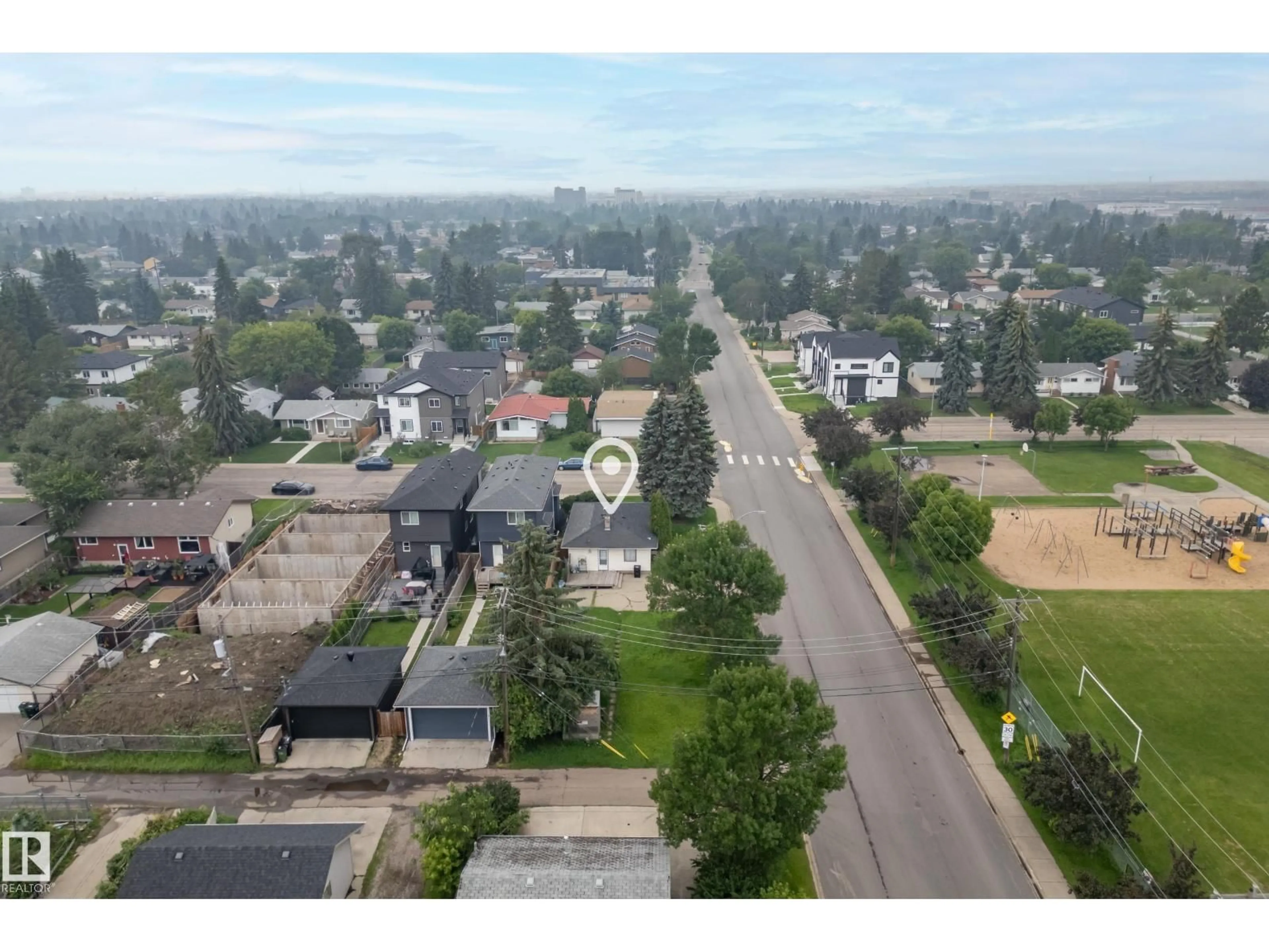 A pic from outside/outdoor area/front of a property/back of a property/a pic from drone, street for NW - 15321 110 AV, Edmonton Alberta T5P1E4