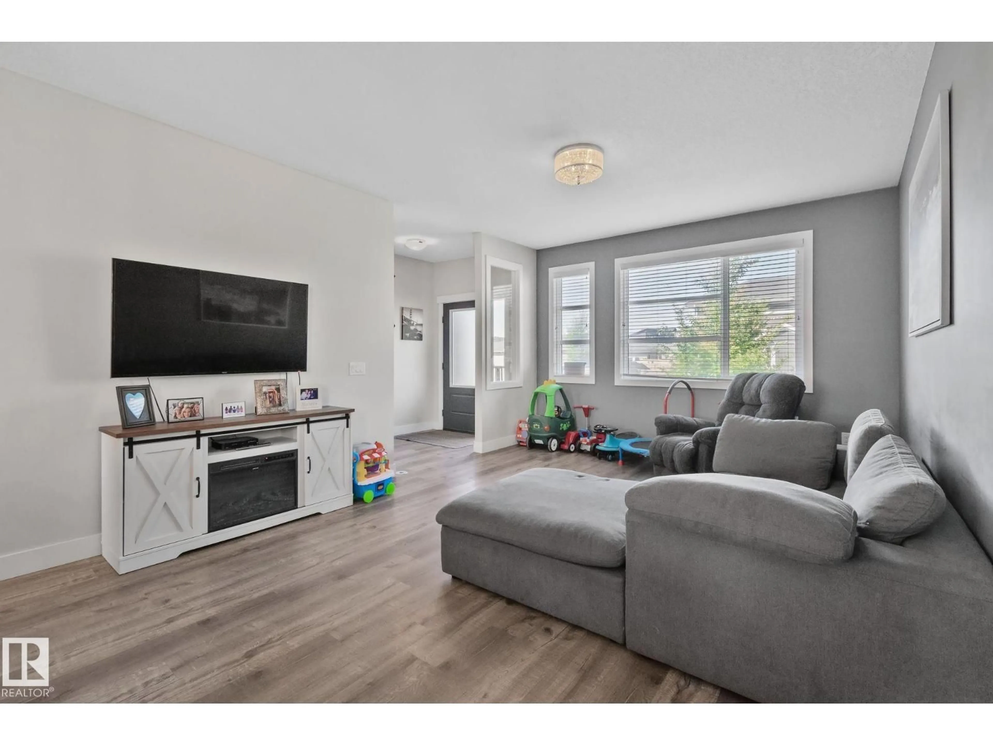 Living room with furniture, wood/laminate floor for 387 WEST HAVEN DR, Leduc Alberta T9E1J3