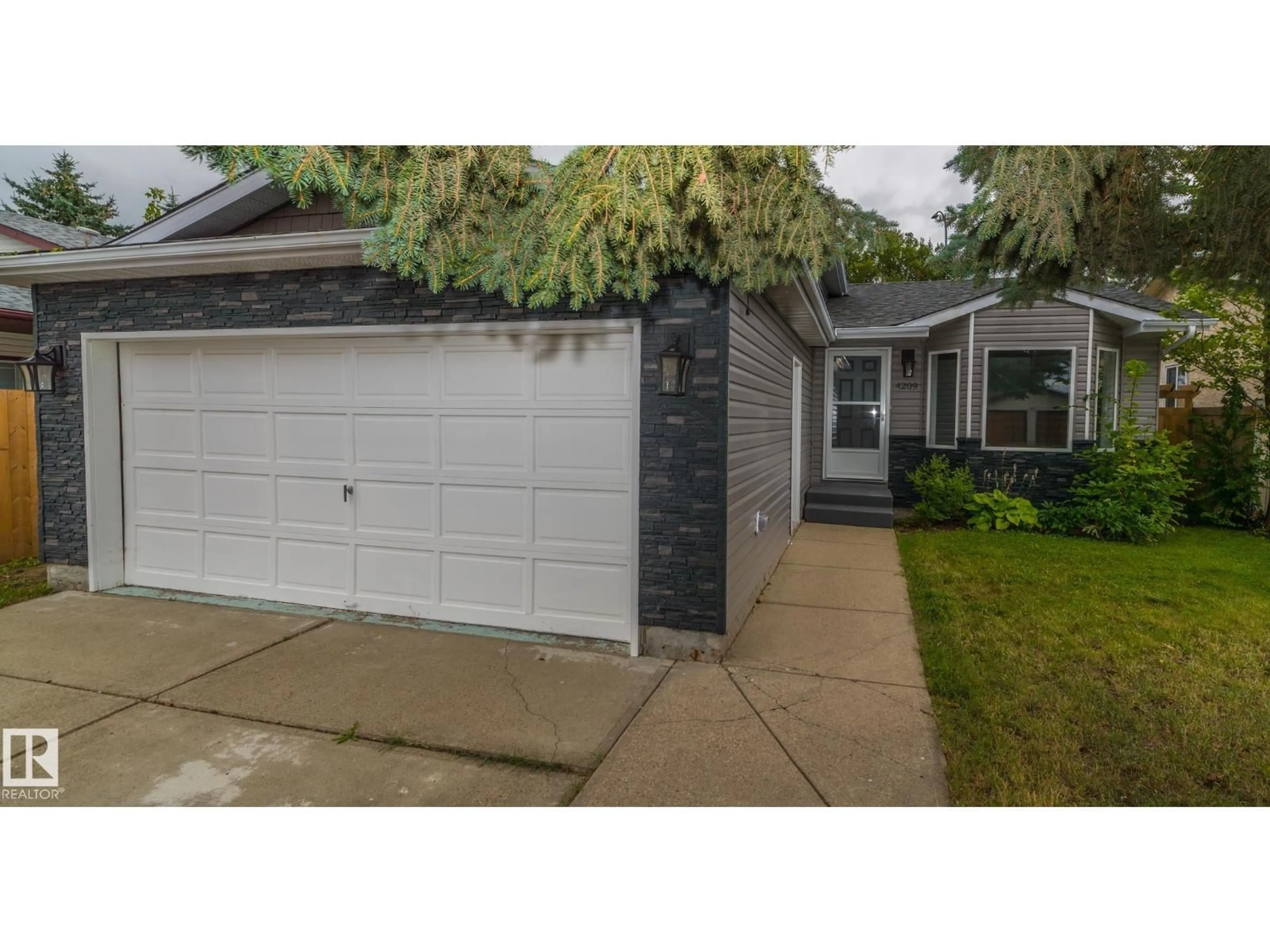 Home with vinyl exterior material, street for 4209 25 AV, Edmonton Alberta T6L6B4