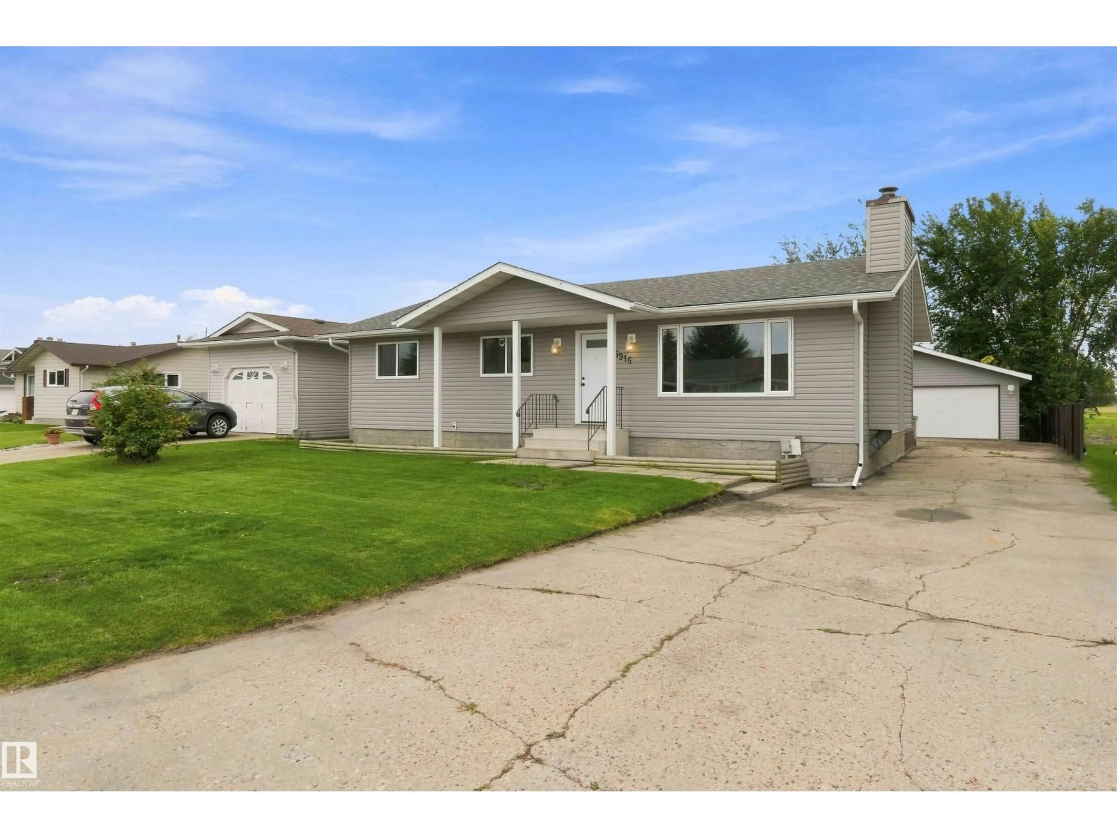 Home with vinyl exterior material, street for 5916 53 AV, Redwater Alberta T0A2W0