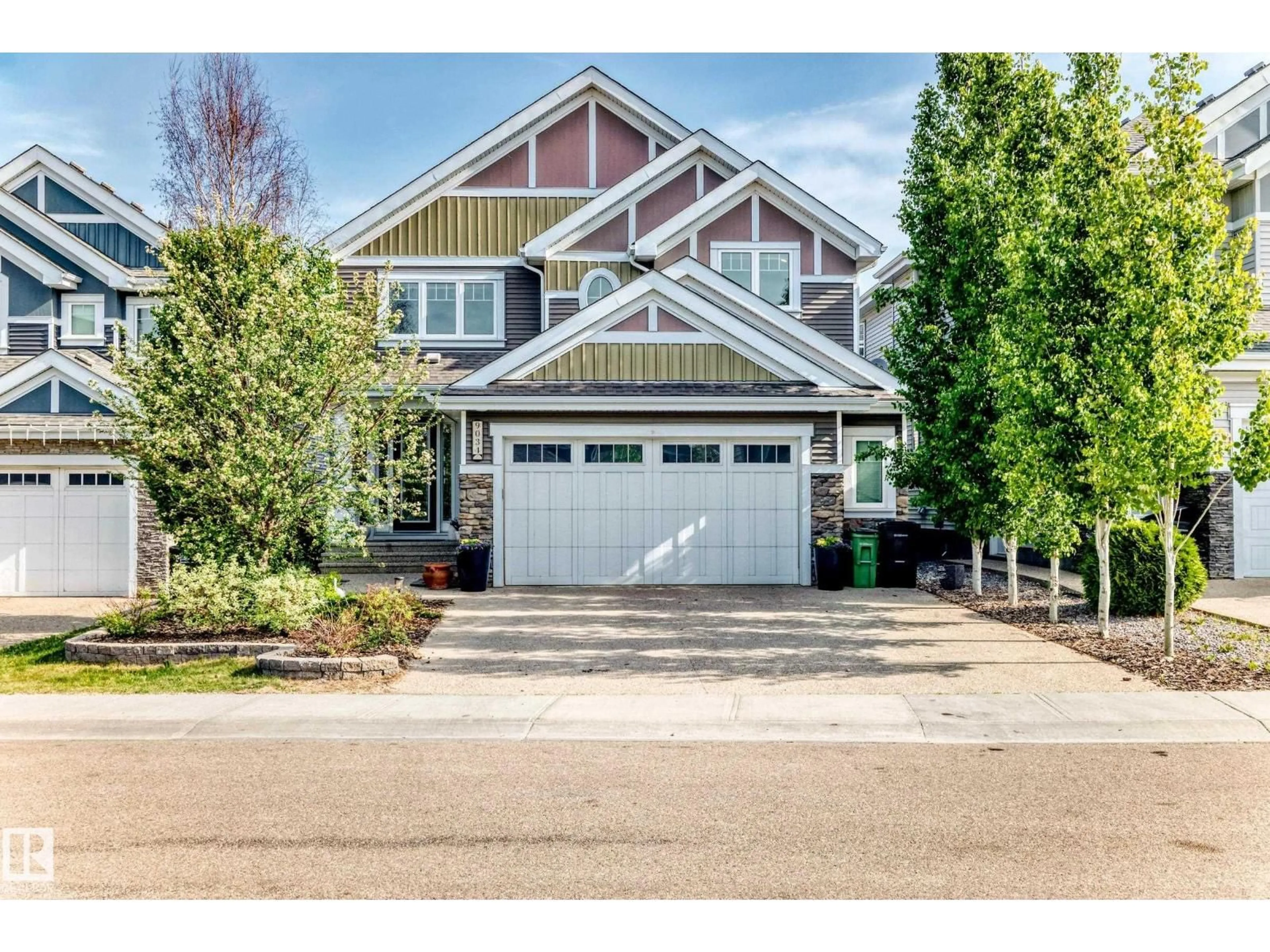 Home with vinyl exterior material, street for SW - 9034 24 AV, Edmonton Alberta T6X2C4