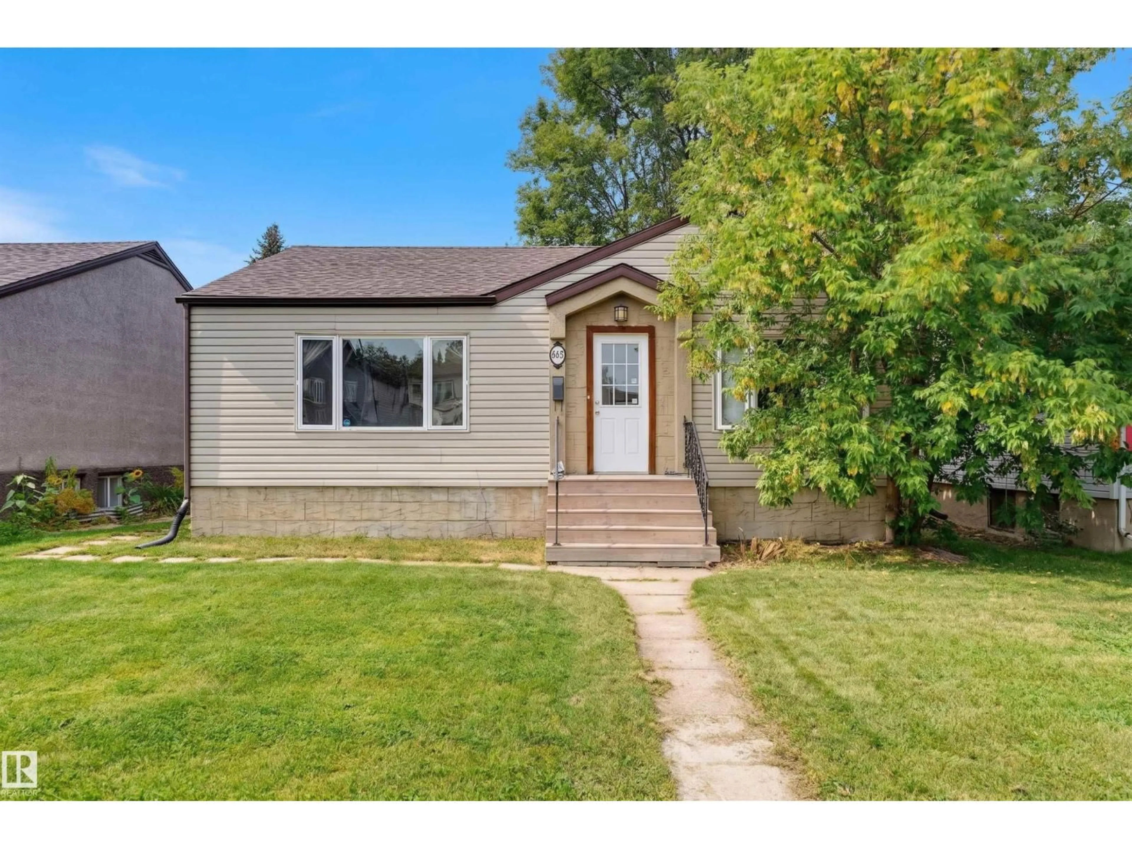 Home with vinyl exterior material, street for 10670 61 AV, Edmonton Alberta T6H1L7