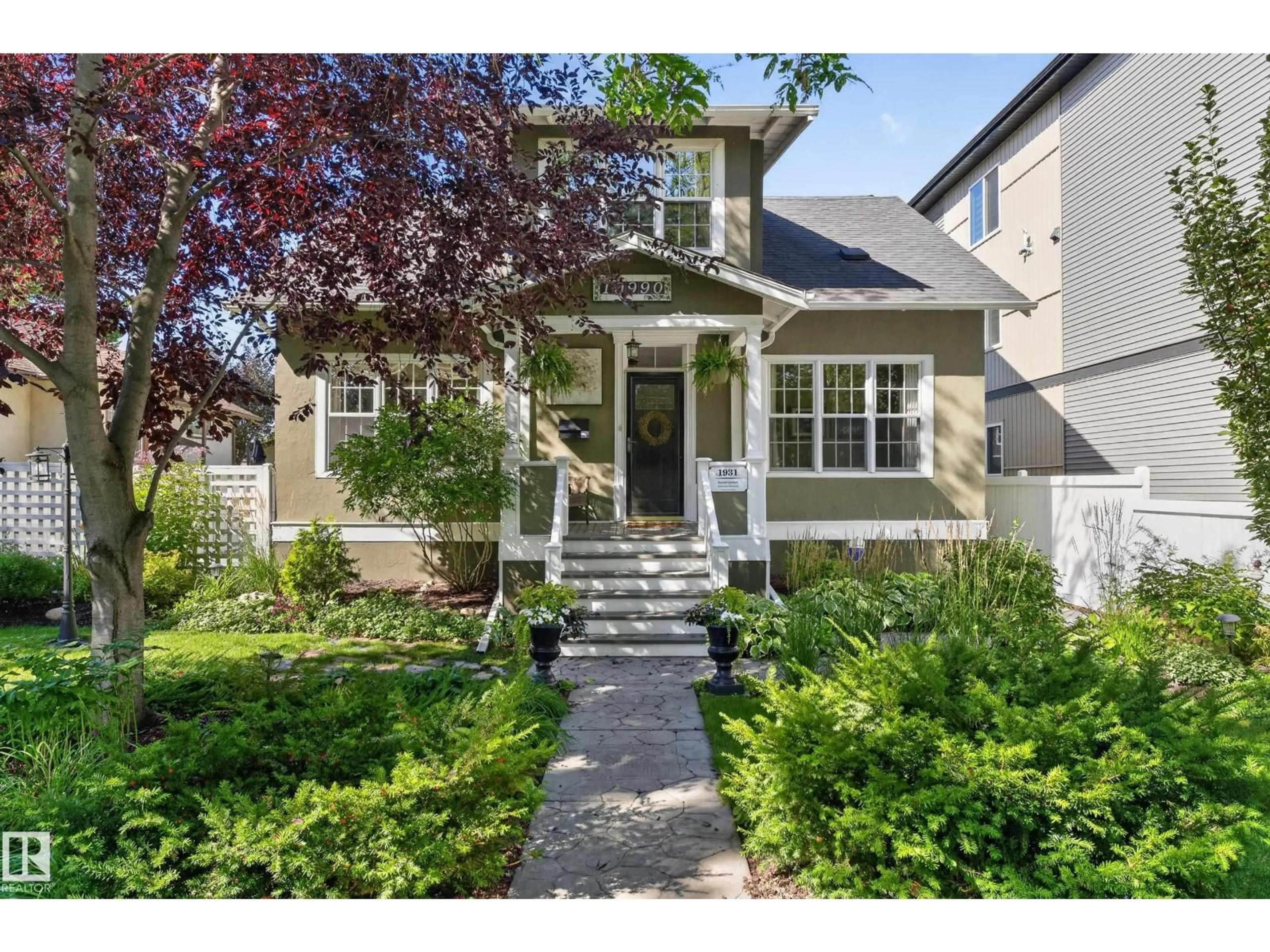 Home with vinyl exterior material, street for 10990 123 STREET, Edmonton Alberta T5M0A2