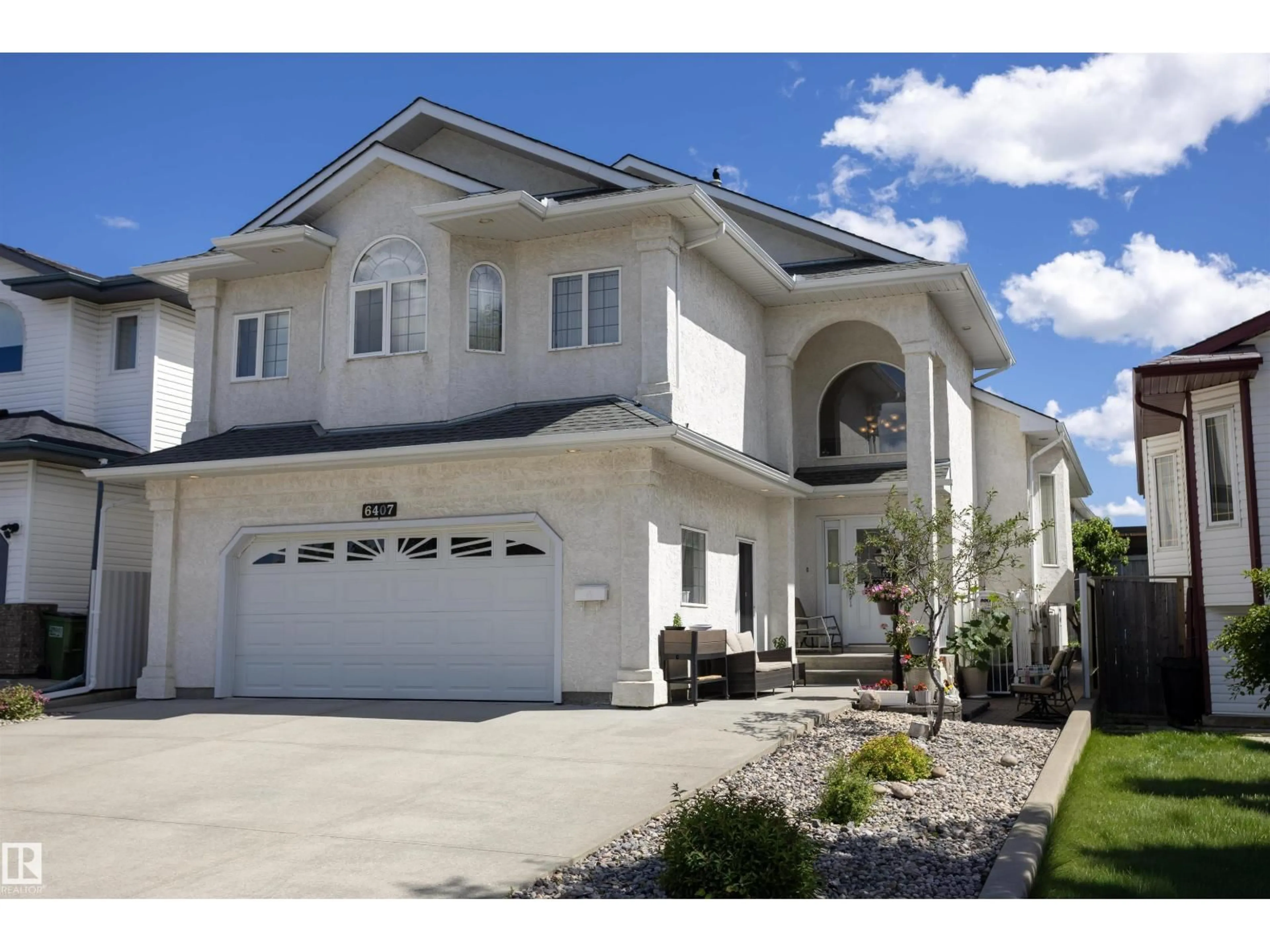 Home with vinyl exterior material, street for 6407 163 AV, Edmonton Alberta T5Y3E3