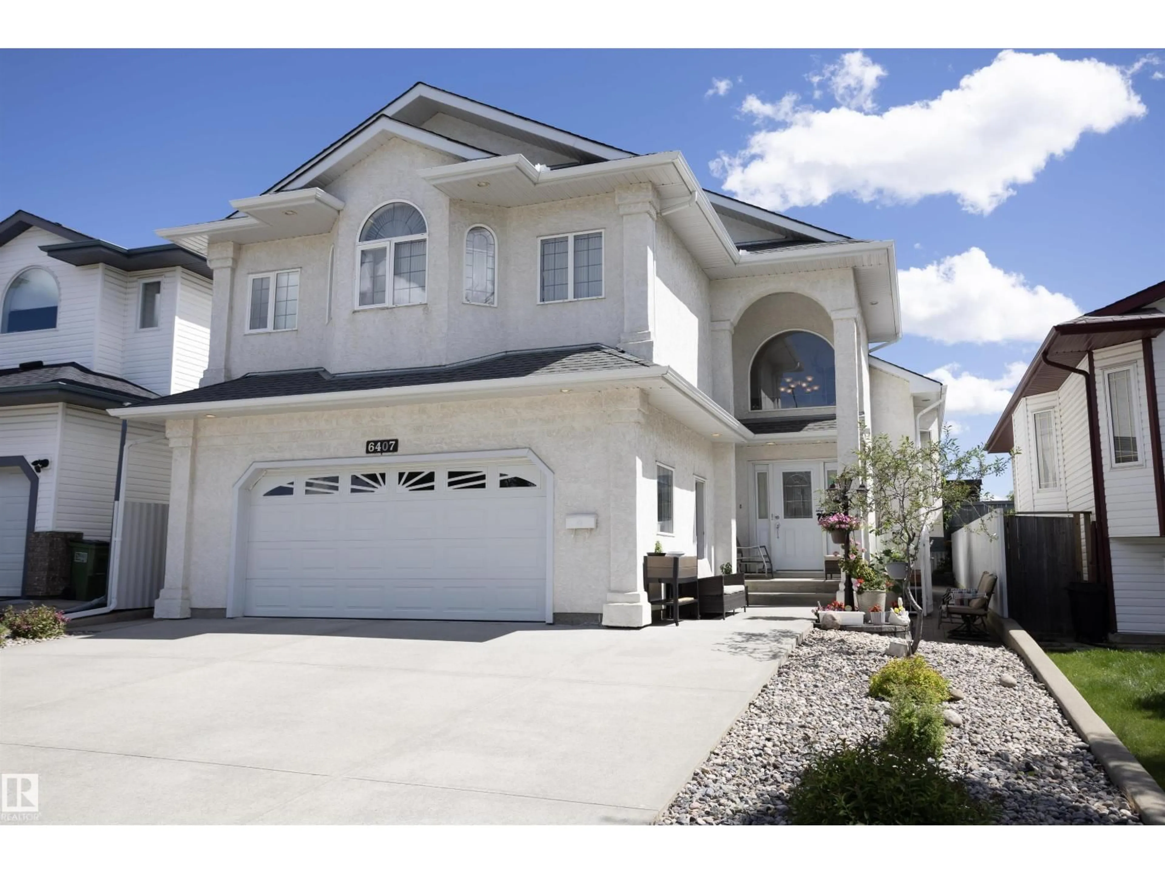 Home with vinyl exterior material, street for 6407 163 AV, Edmonton Alberta T5Y3E3