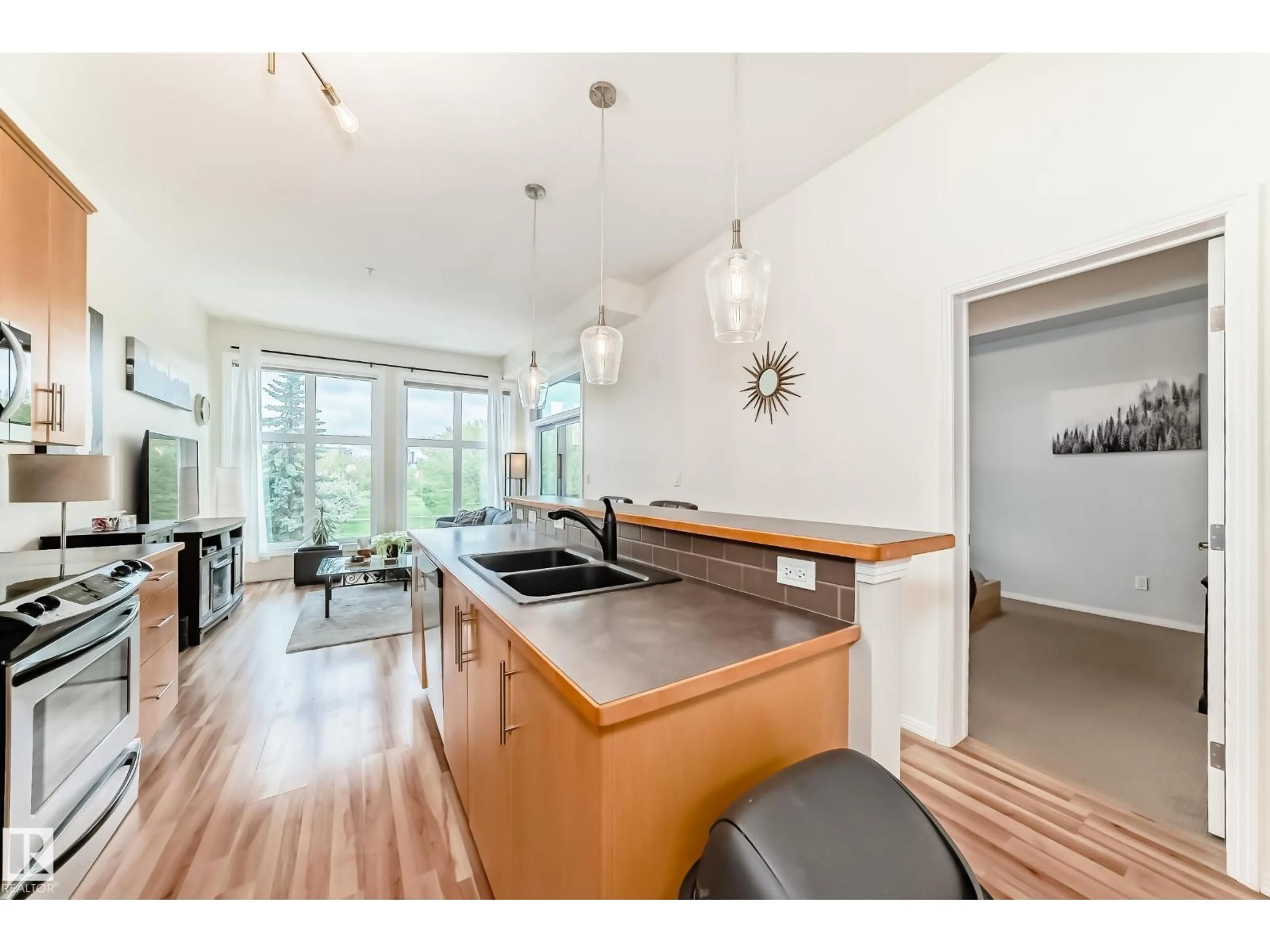 Open concept kitchen, wood/laminate floor for #303 - 10531 117 ST NW, Edmonton Alberta T5H0A8