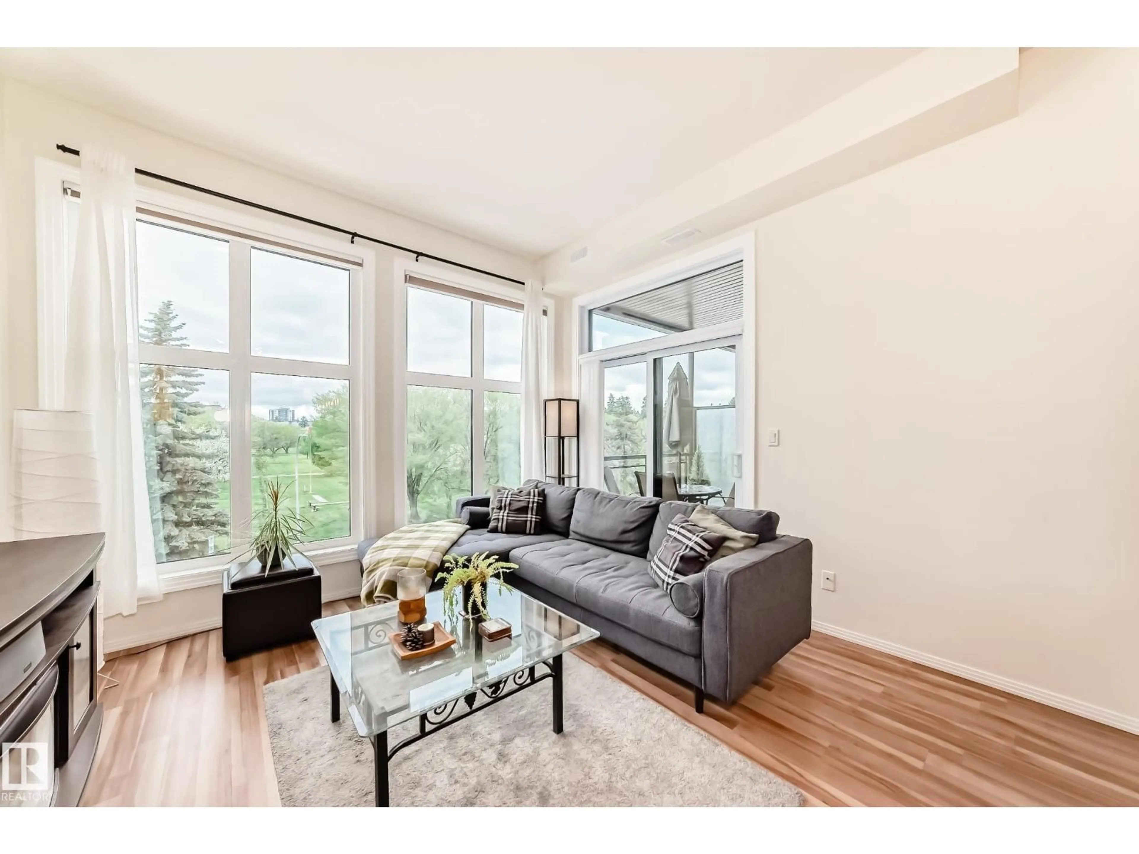 Living room with furniture, wood/laminate floor for #303 - 10531 117 ST NW, Edmonton Alberta T5H0A8