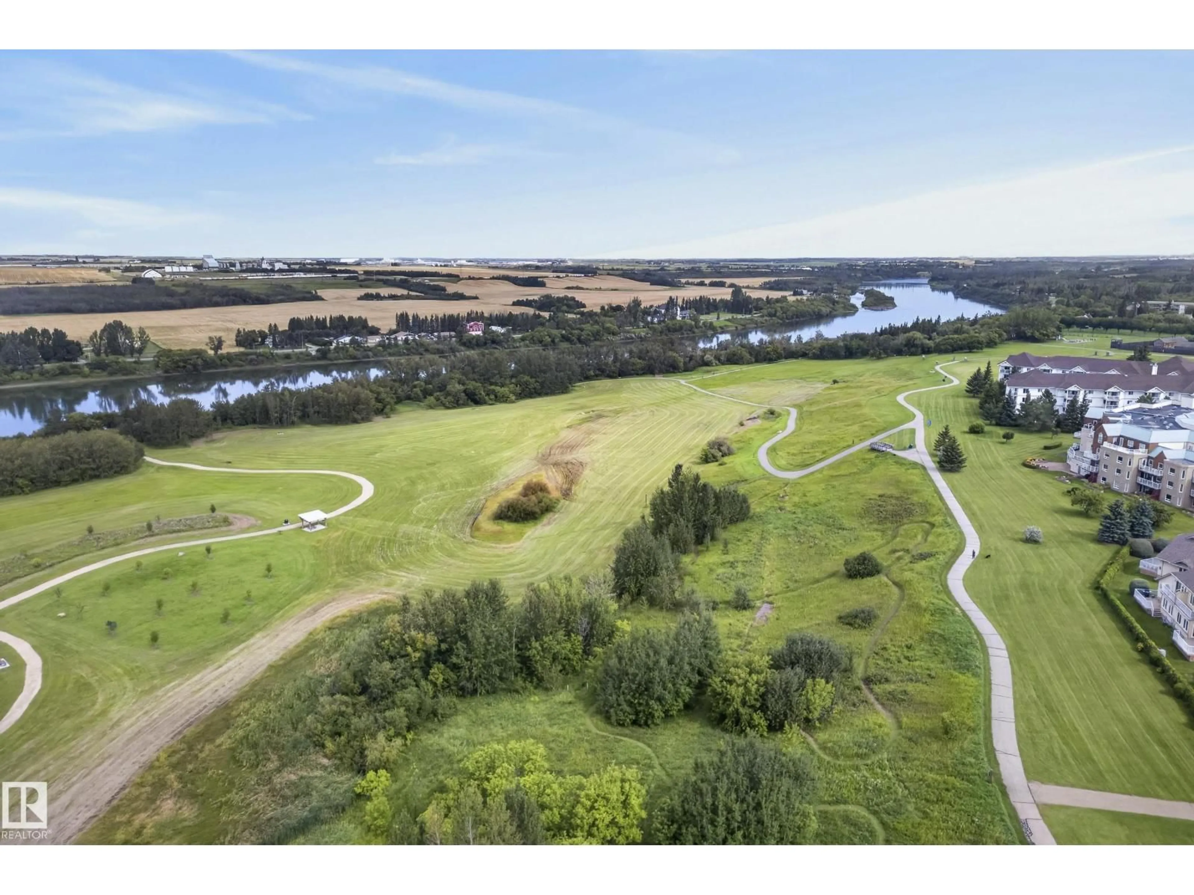 A pic from outside/outdoor area/front of a property/back of a property/a pic from drone, water/lake/river/ocean view for #407 - 9940 SHERRIDON DR, Fort Saskatchewan Alberta T8L4C9
