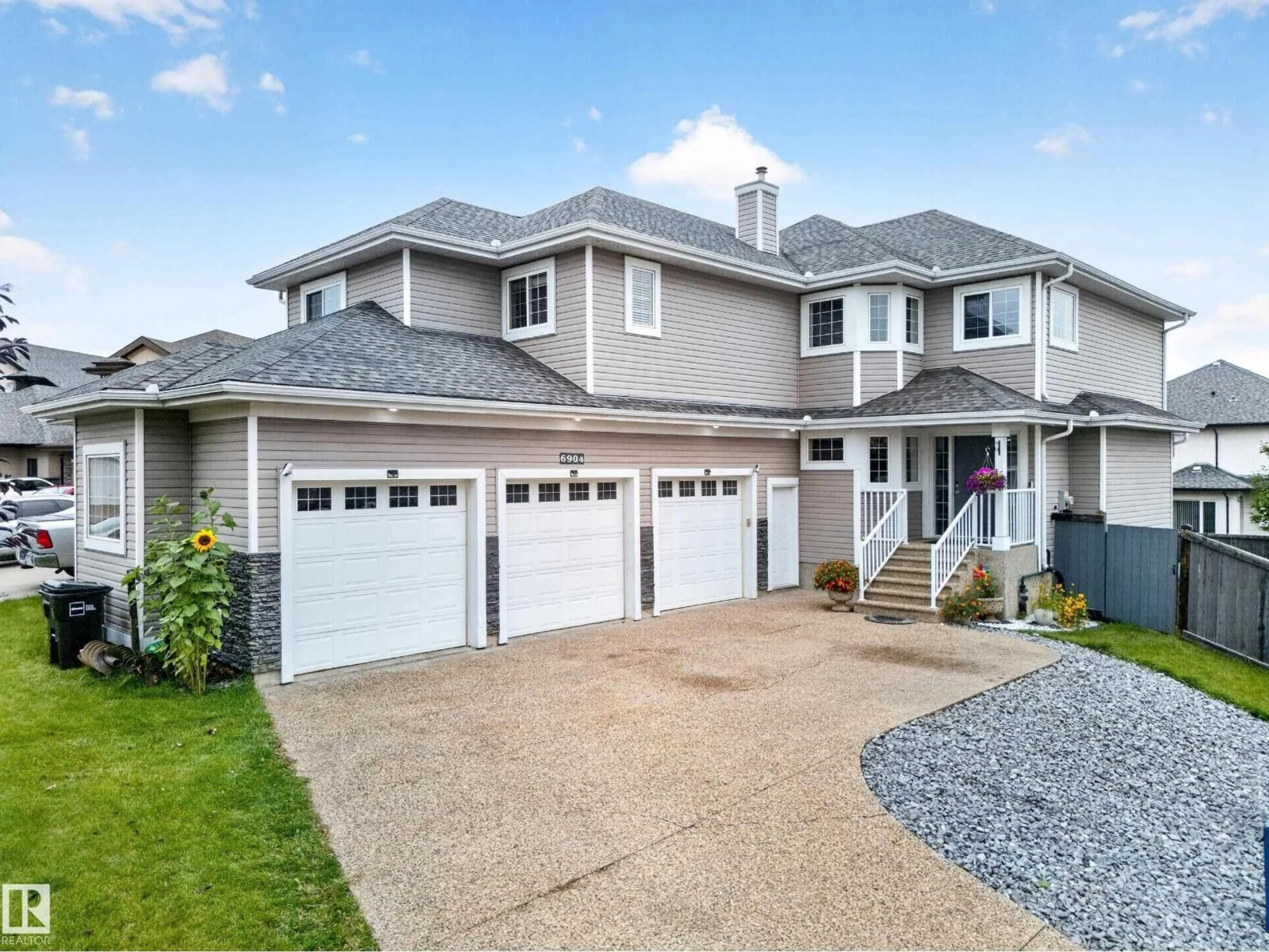Home with vinyl exterior material, street for SW - 6904 18 AV, Edmonton Alberta T6X0C9