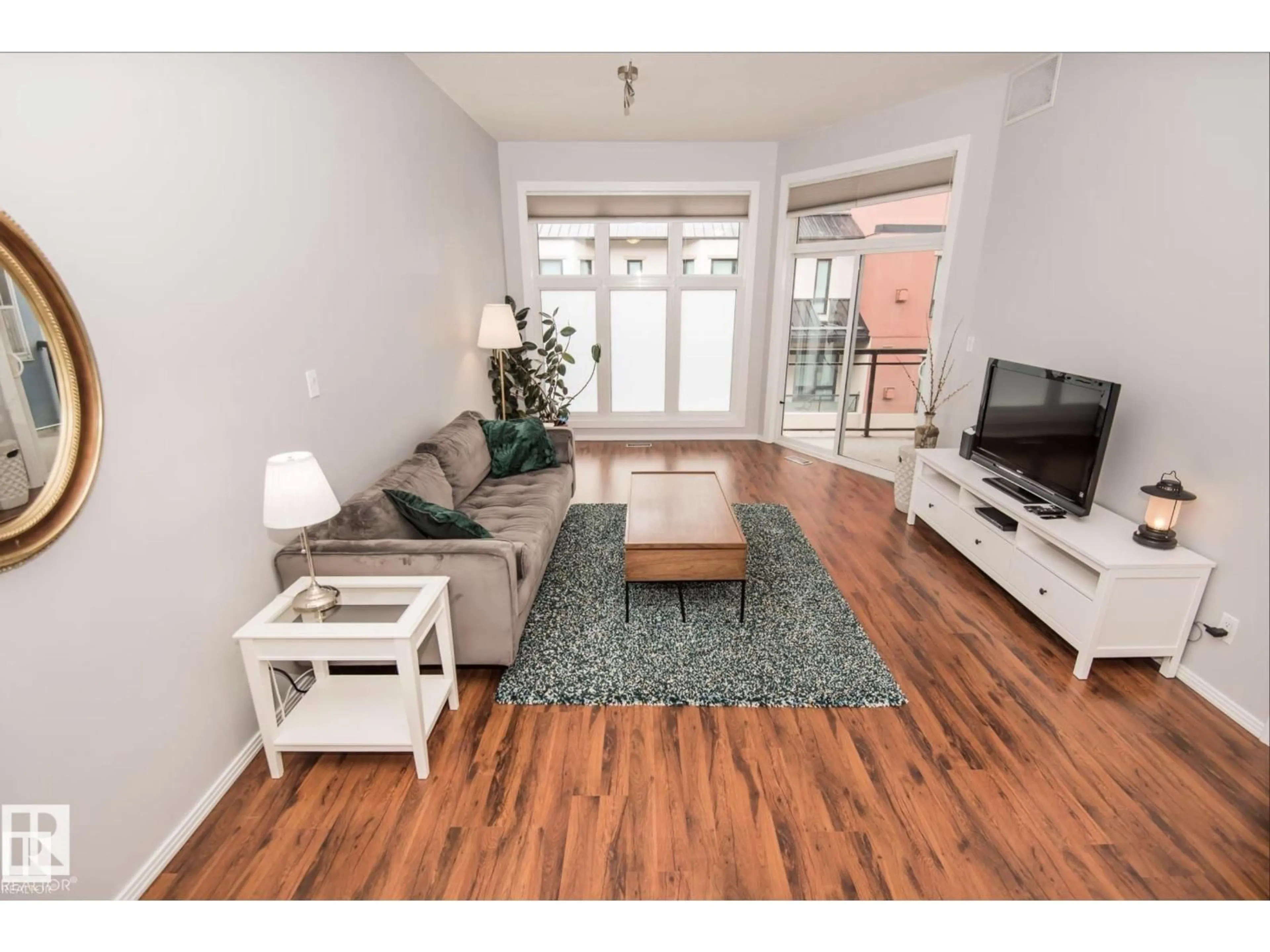 Living room with furniture, wood/laminate floor for 415 - 10147 112 ST NW, Edmonton Alberta T5K1M1