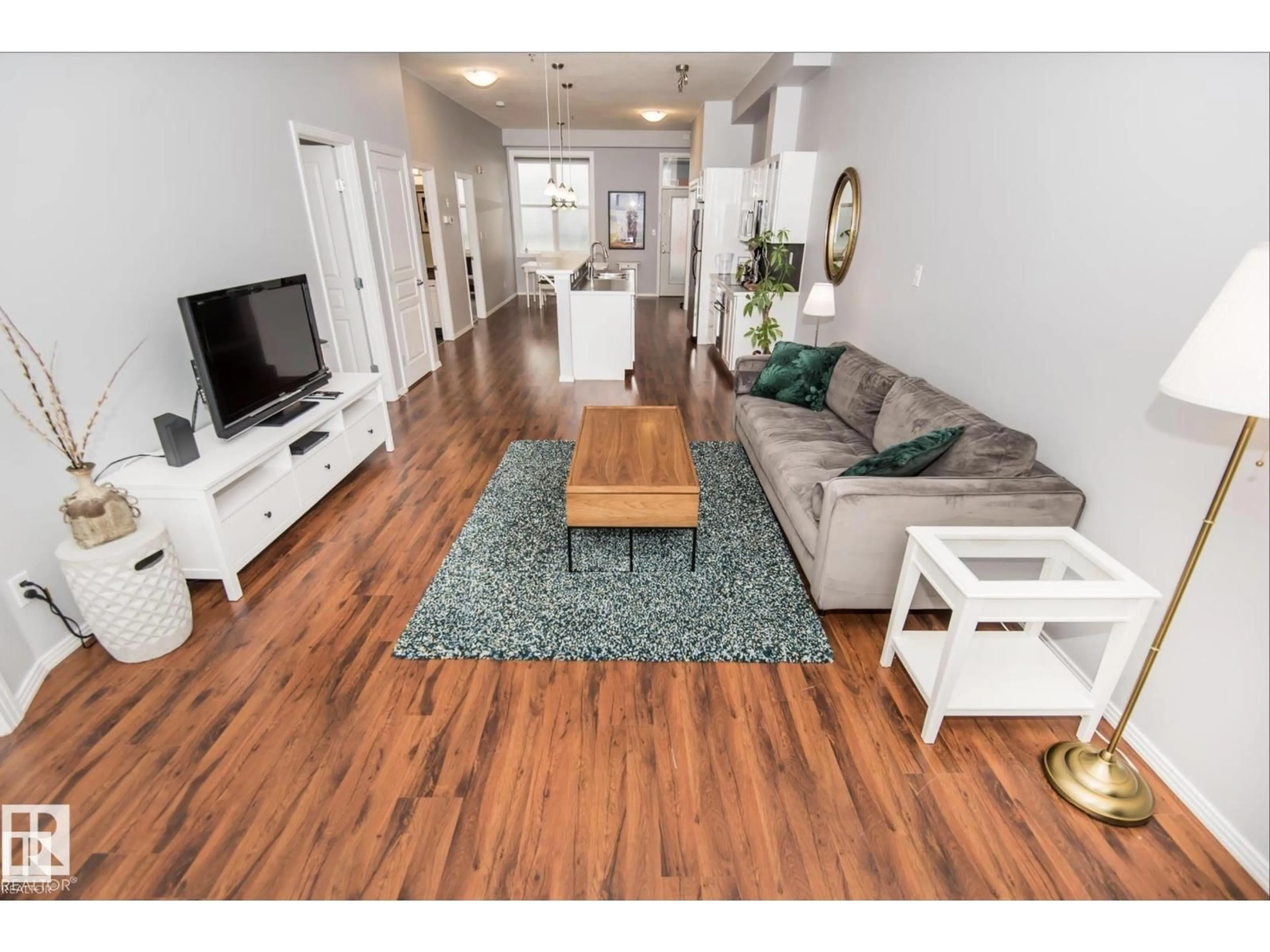 Living room with furniture, wood/laminate floor for 415 - 10147 112 ST NW, Edmonton Alberta T5K1M1