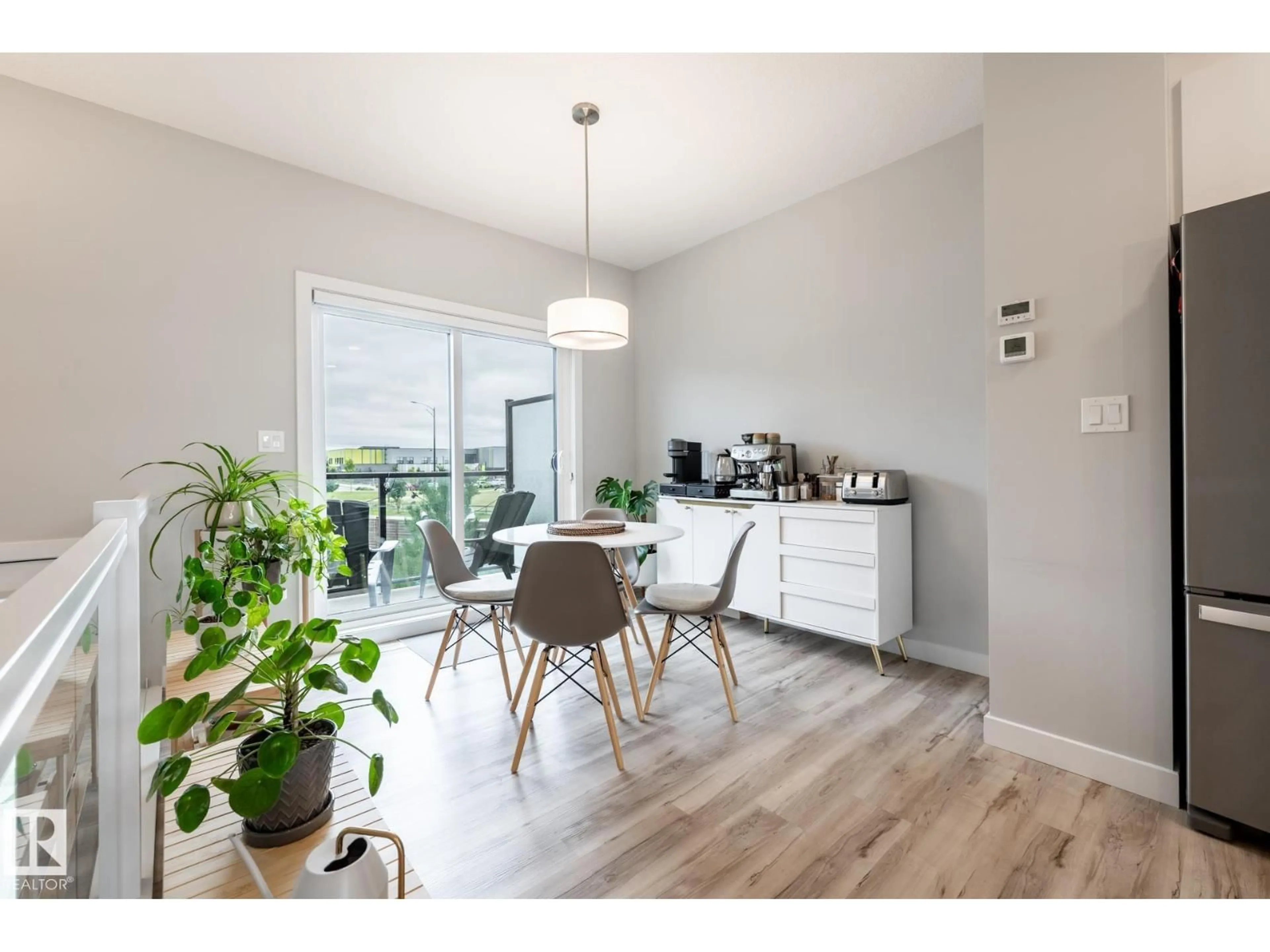 Open concept kitchen, wood/laminate floor for #56 - 1729 KEENE CR, Edmonton Alberta T6W4B6