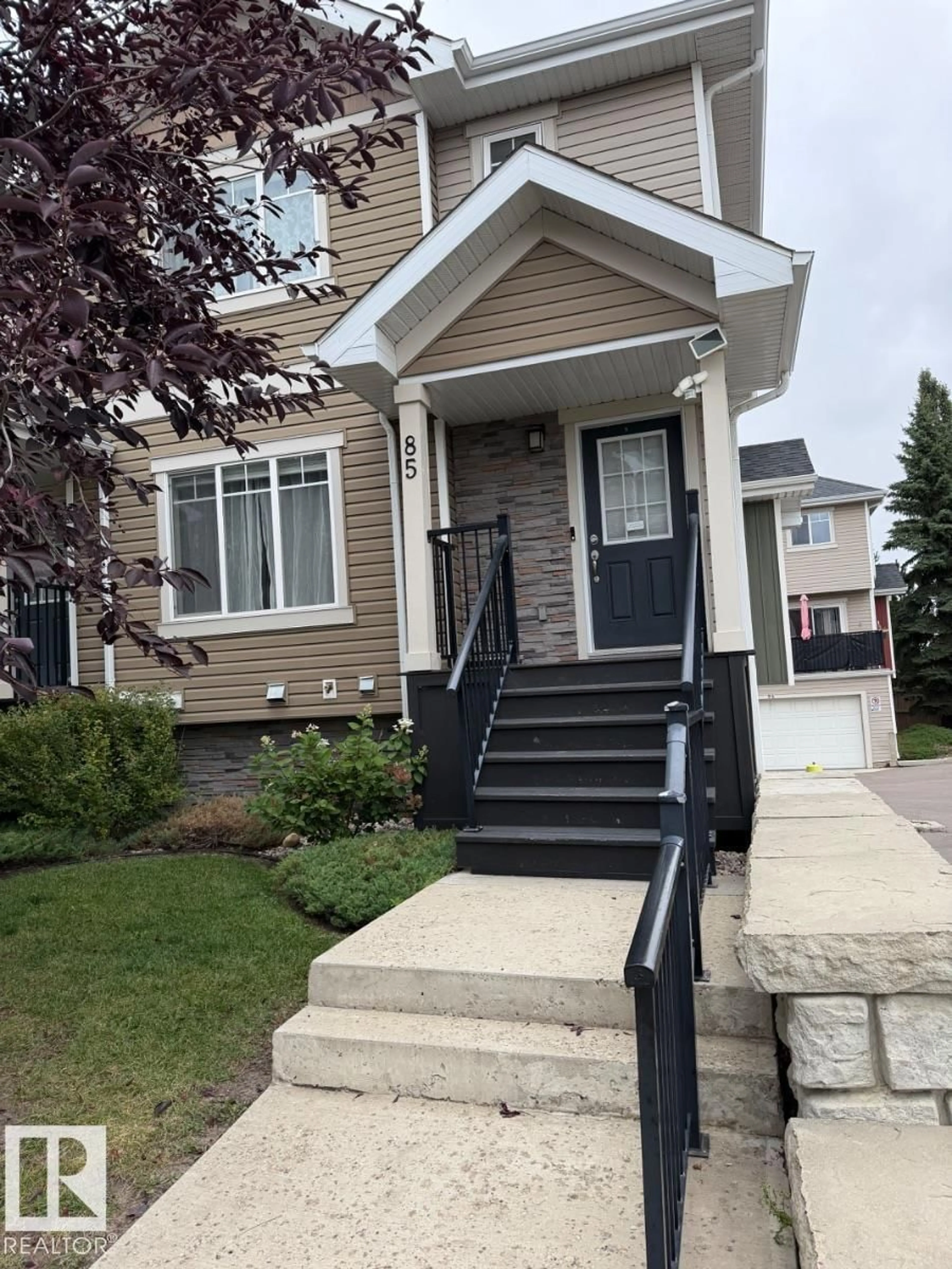 Home with vinyl exterior material, street for 85 9535 217 ST NW, Edmonton Alberta T5T4P5