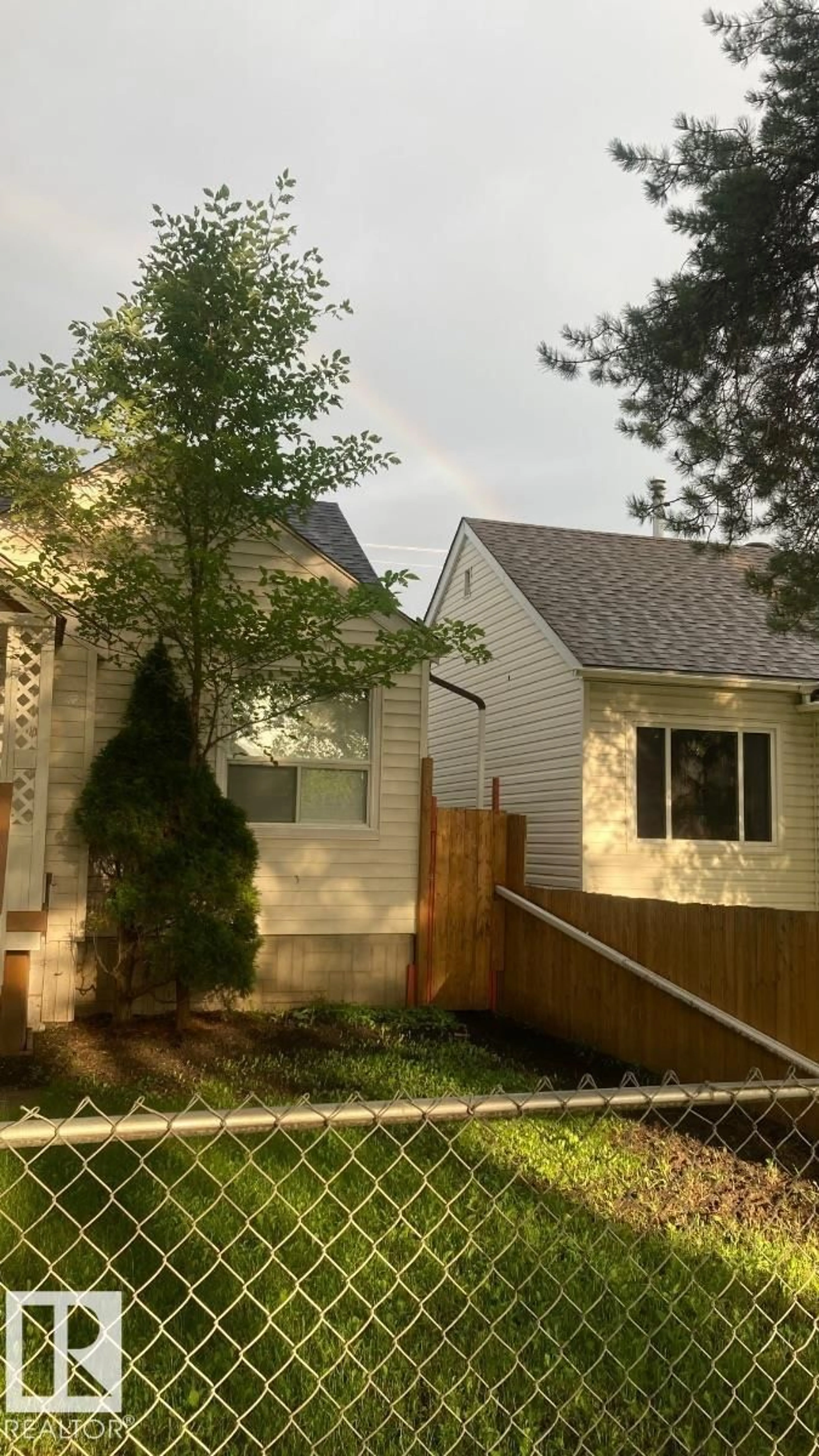 Home with vinyl exterior material, street for NW - 11438 83 ST, Edmonton Alberta T5B2Y3