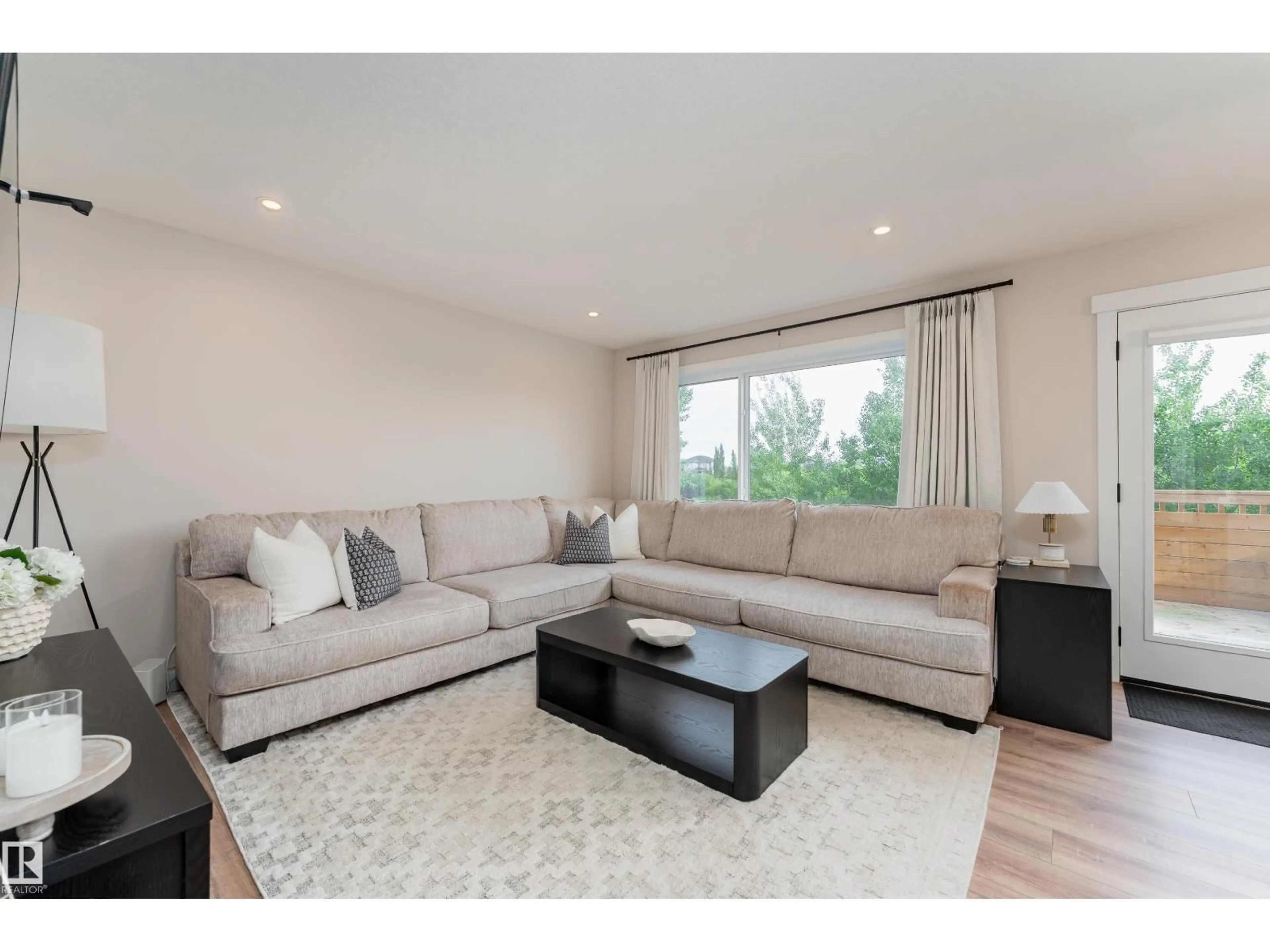 Living room with furniture, wood/laminate floor for 584 MEADOWVIEW DR, Fort Saskatchewan Alberta T8L0X1