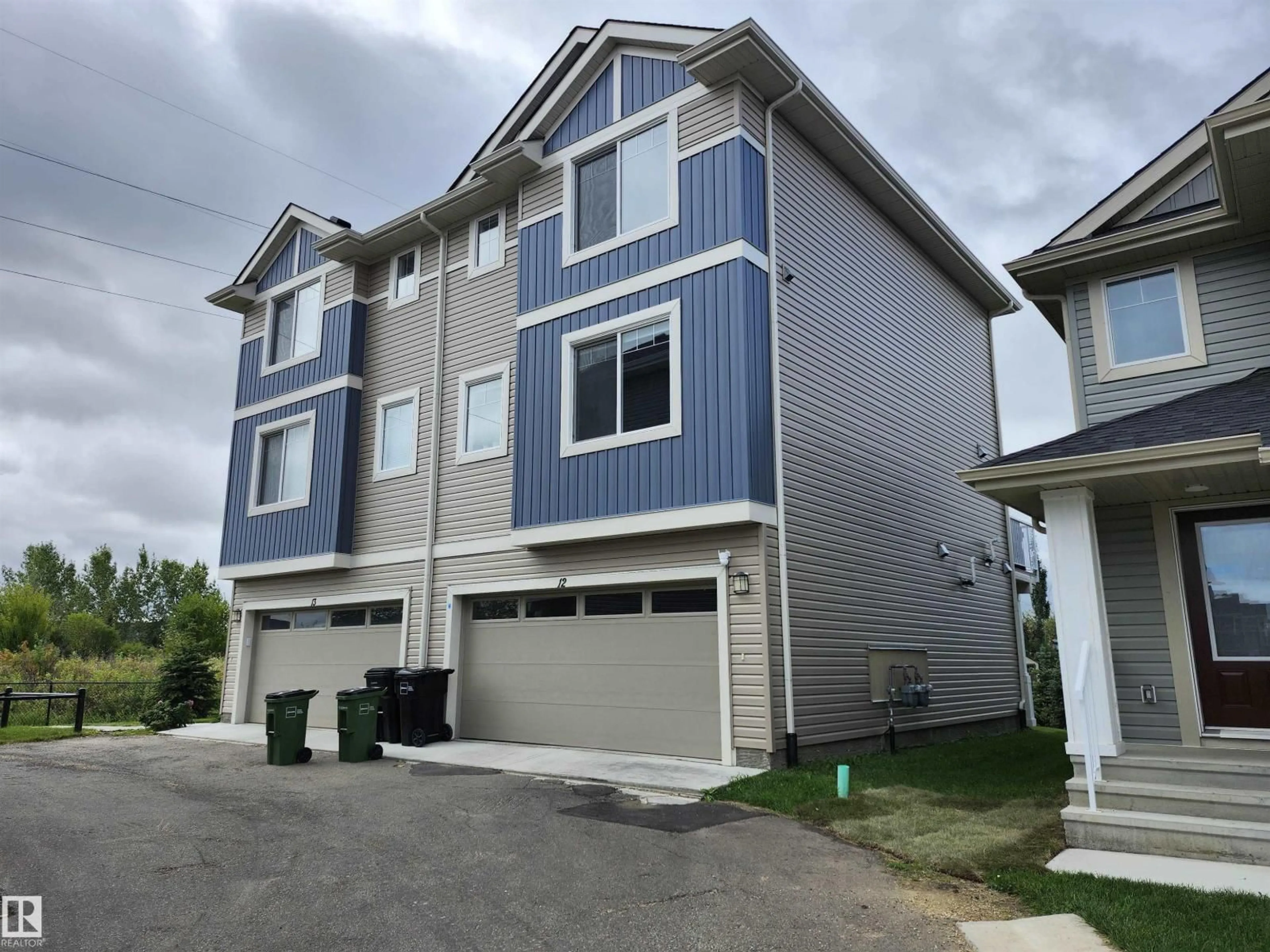 Home with vinyl exterior material, street for 12 13139 205 ST NW, Edmonton Alberta T5S0N1