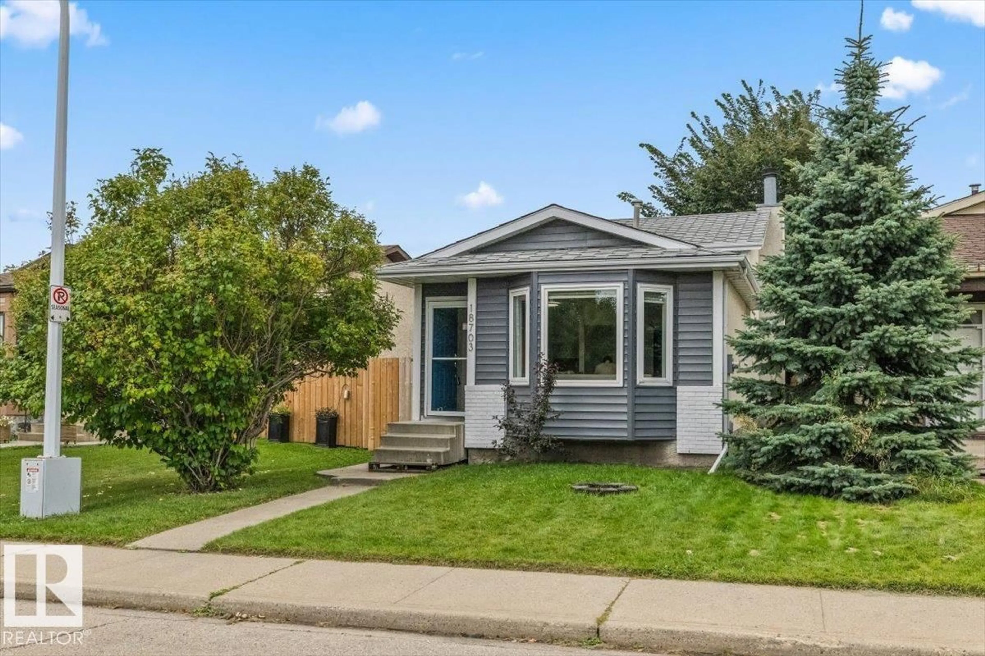 Home with vinyl exterior material, street for 18703 57 AV, Edmonton Alberta T6M2A6