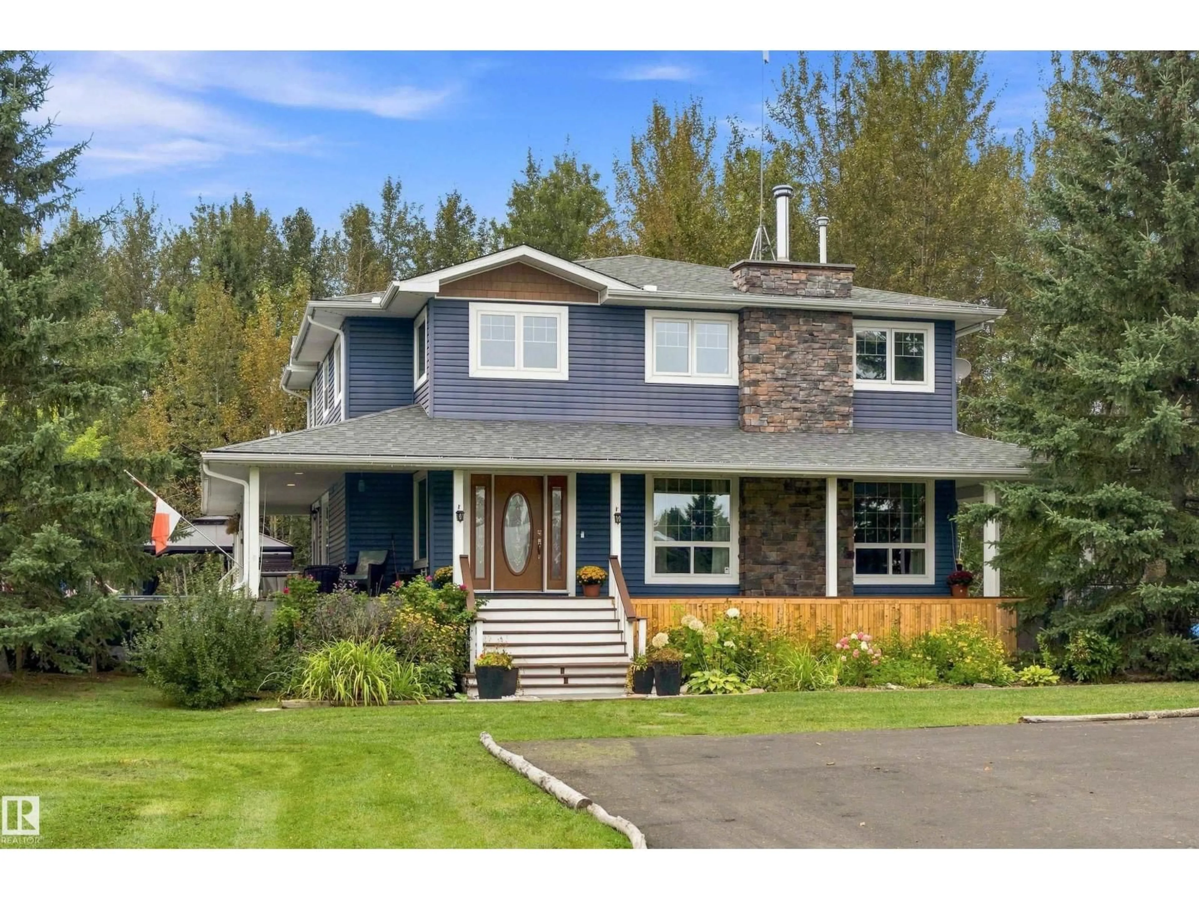 Home with vinyl exterior material, street for 24 TWP ROAD 512 TWP ROAD, Rural Parkland County Alberta T7Y1C6