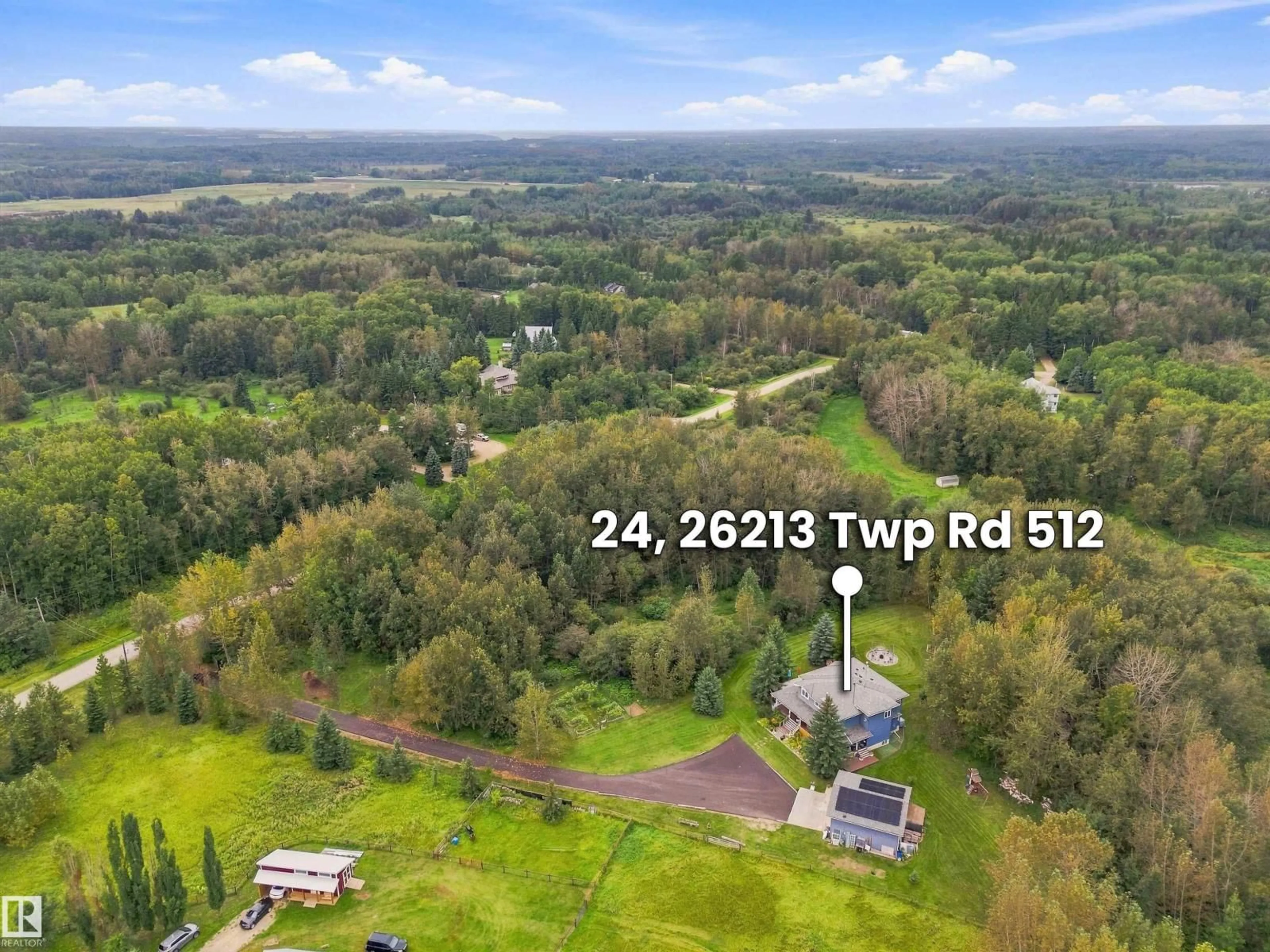 A pic from outside/outdoor area/front of a property/back of a property/a pic from drone, forest/trees view for 24 TWP ROAD 512 TWP ROAD, Rural Parkland County Alberta T7Y1C6