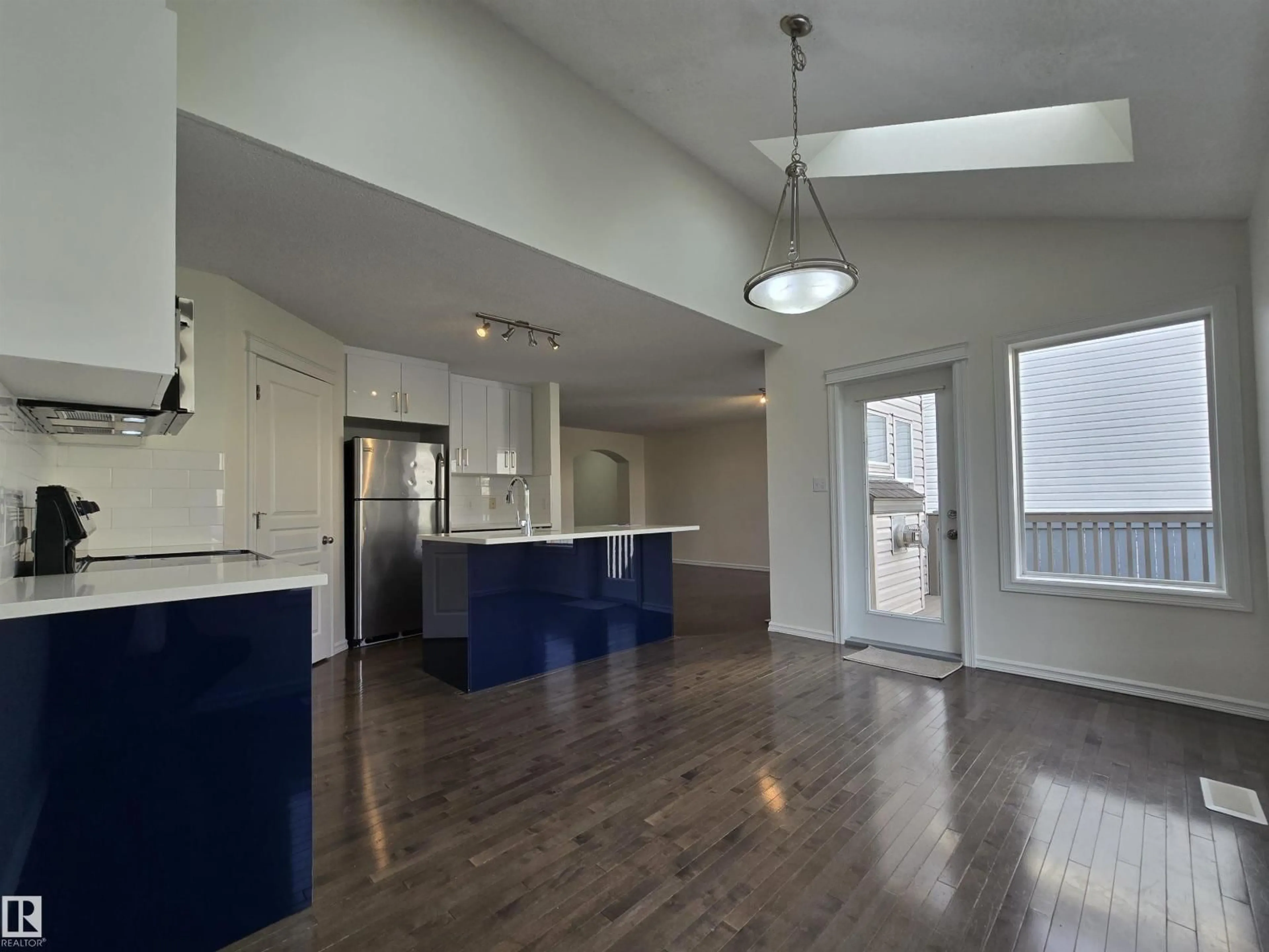 Open concept kitchen, wood/laminate floor for 21208 89A AV, Edmonton Alberta T5T6V5
