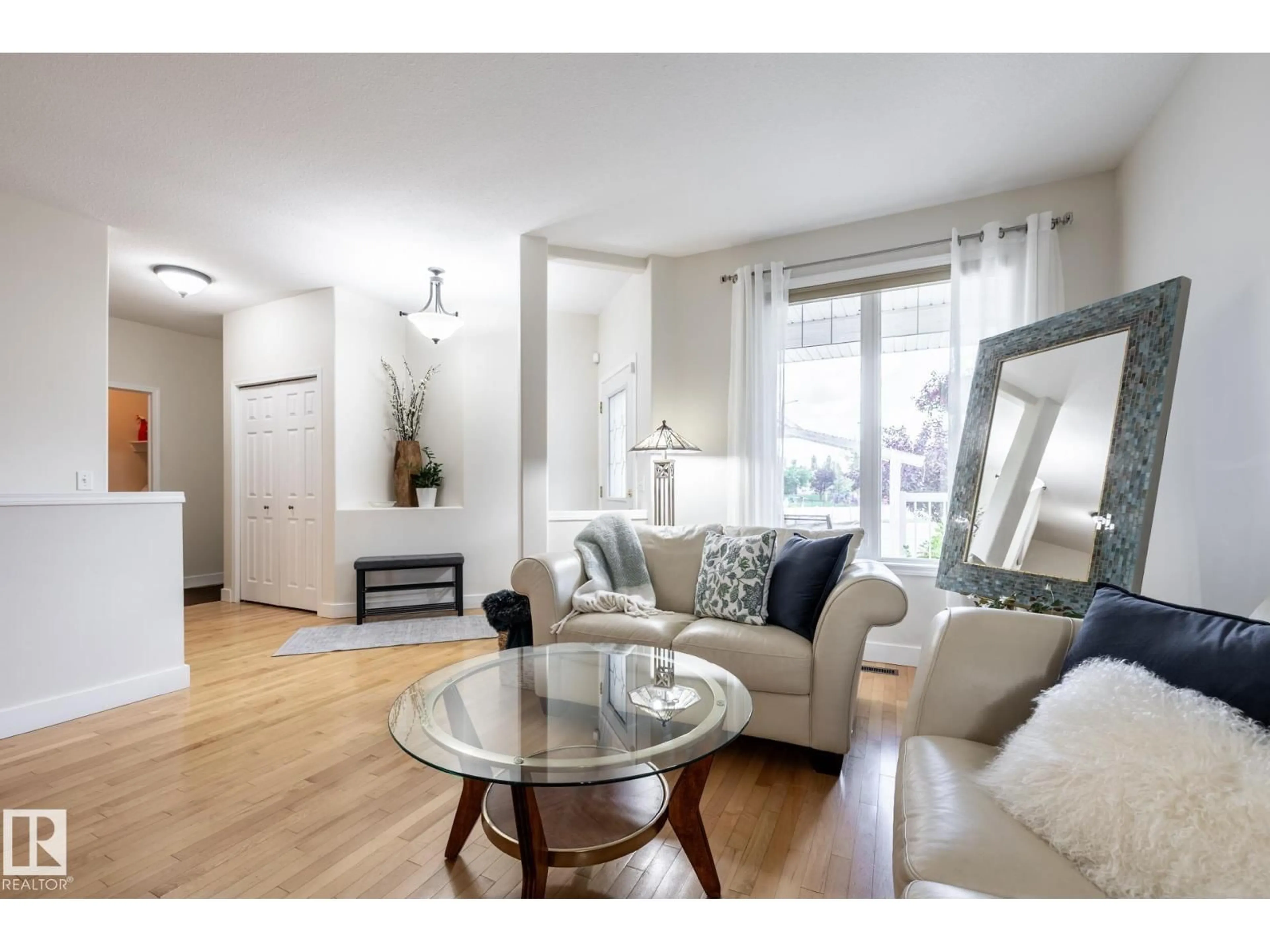 Living room with furniture, wood/laminate floor for 9 - 13 DEER PARK DR, Spruce Grove Alberta T7X4H8