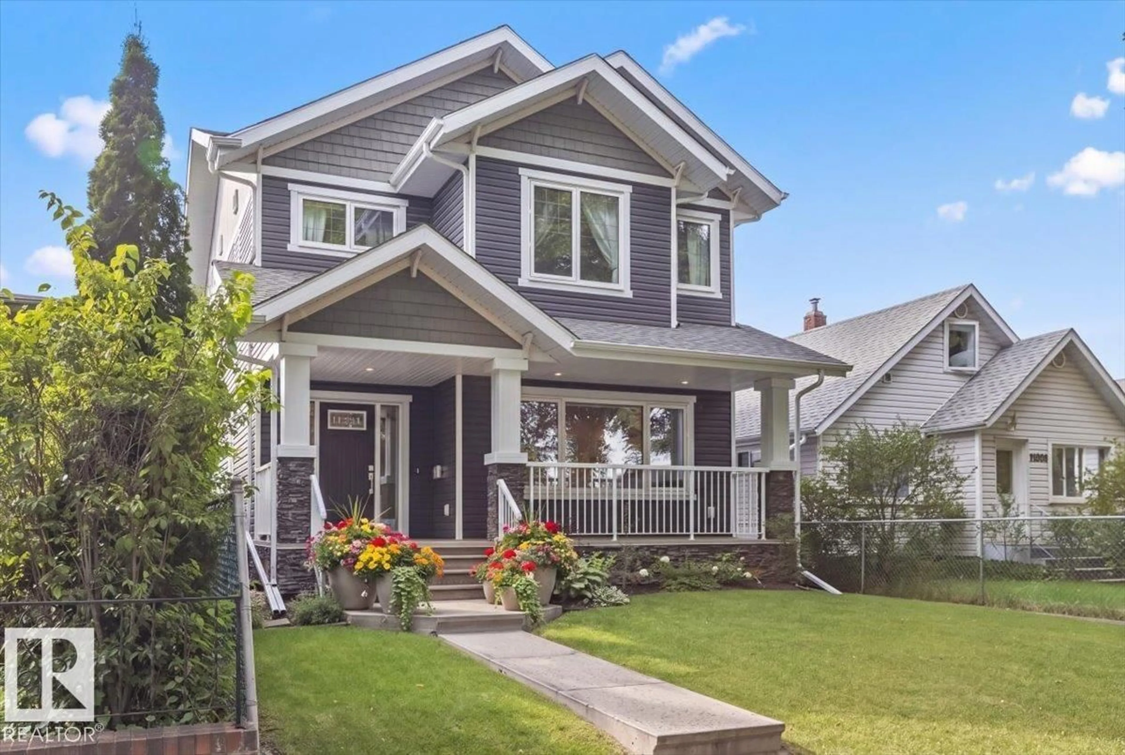 Home with vinyl exterior material, street for NW - 11324 87 ST, Edmonton Alberta T5B3L9