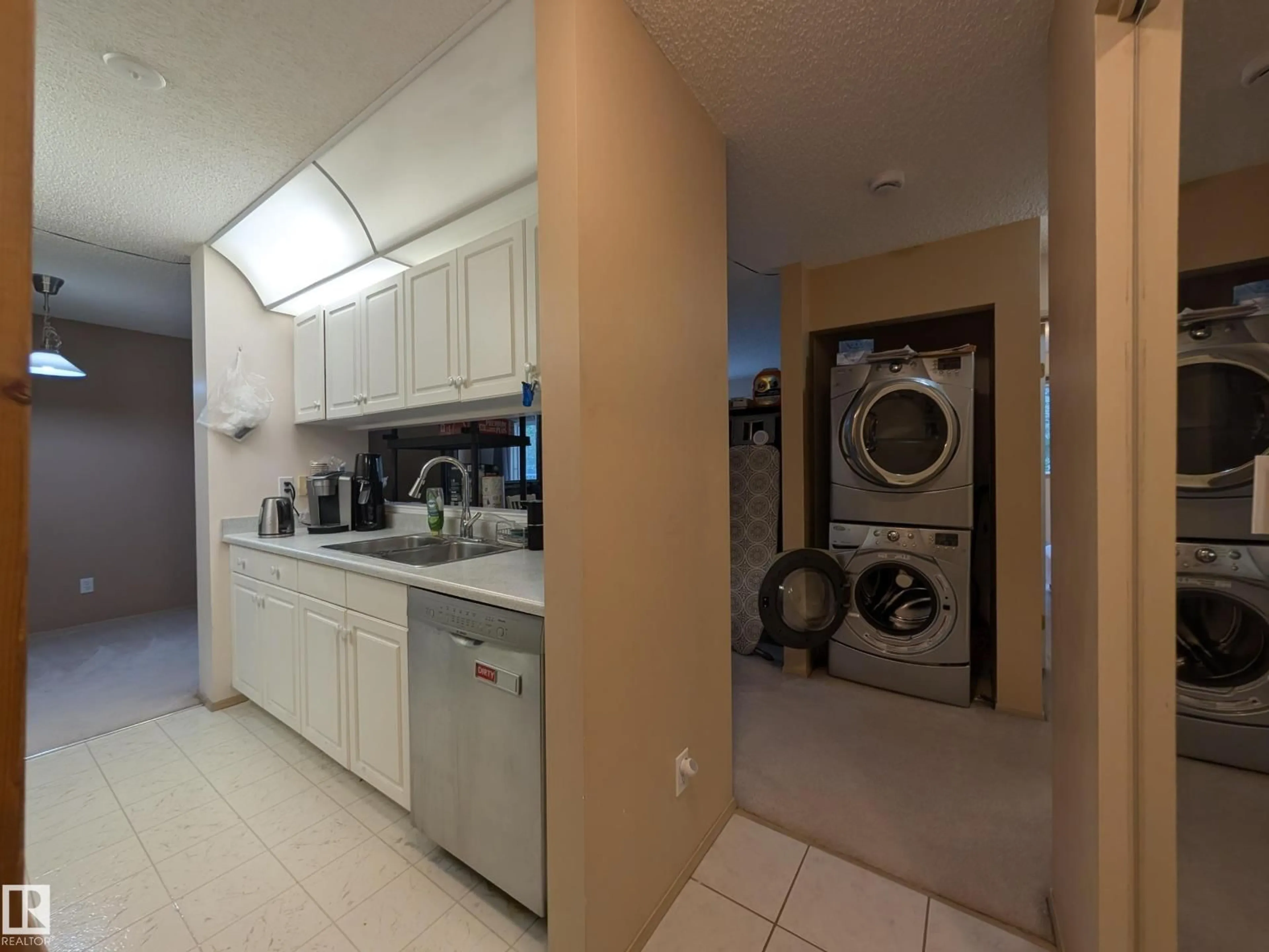 Kitchen with laundary machines, unknown for 310 17467 98A AV NW, Edmonton Alberta T5T6E9