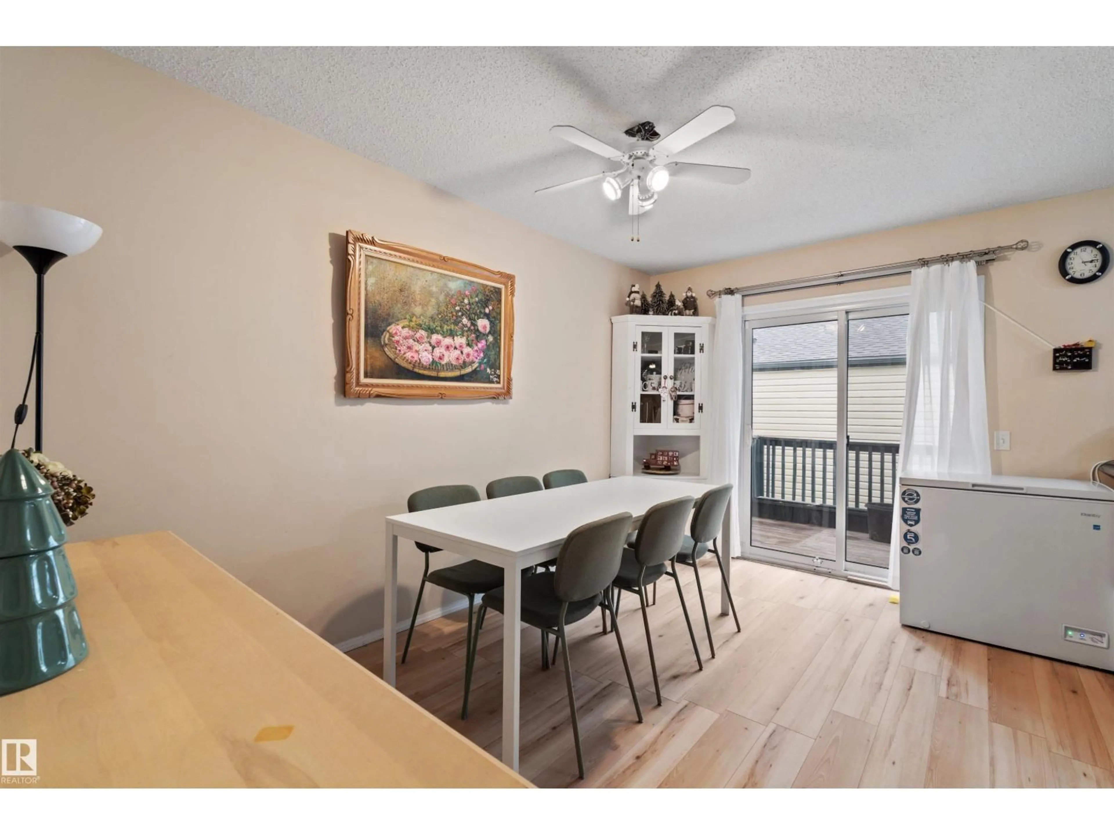 Dining room, wood/laminate floor for 10909 106 ST NW, Edmonton Alberta T5H4M7