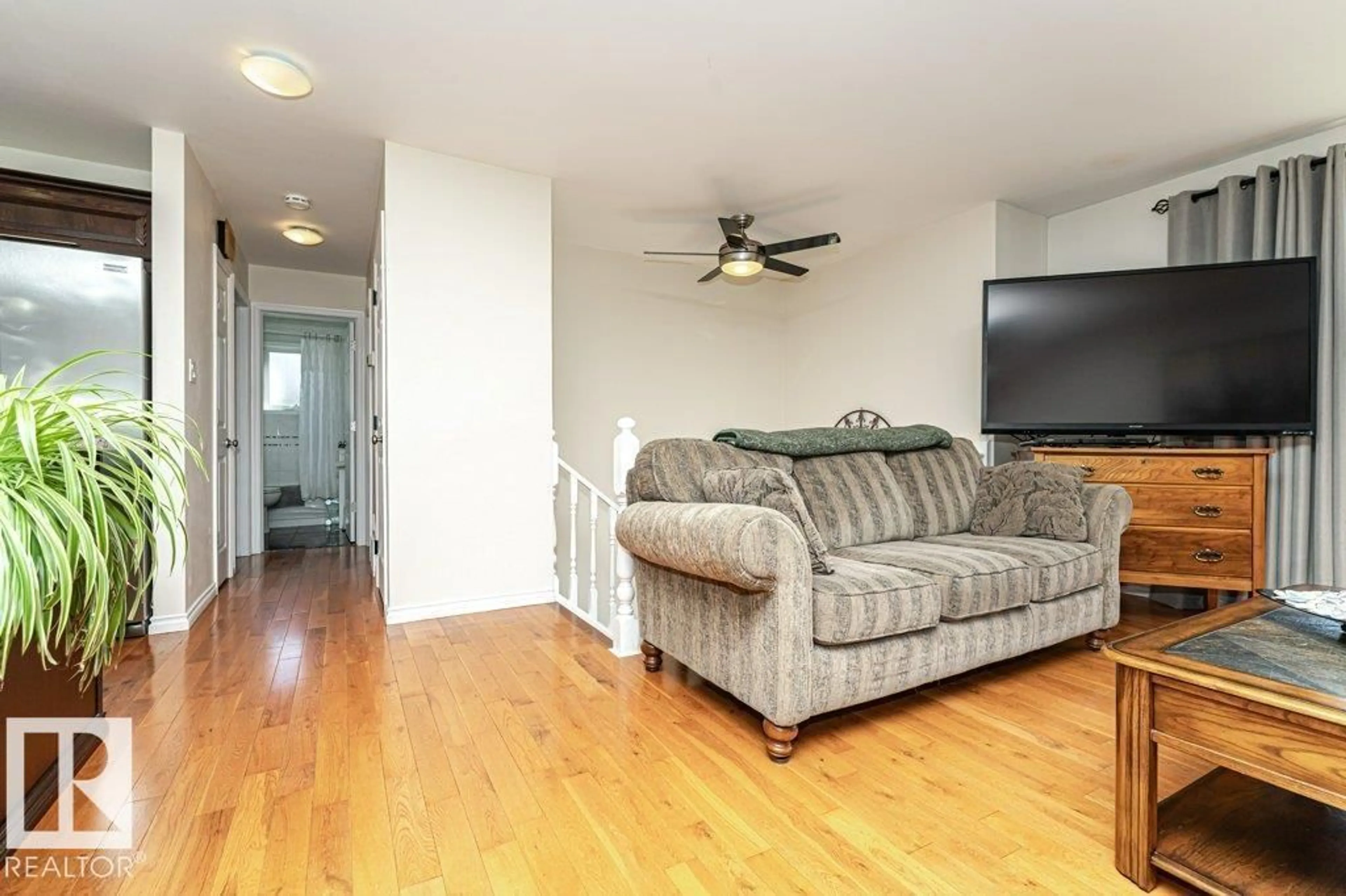 Living room with furniture, wood/laminate floor for 5924 11 AV, Edmonton Alberta T6L3A6