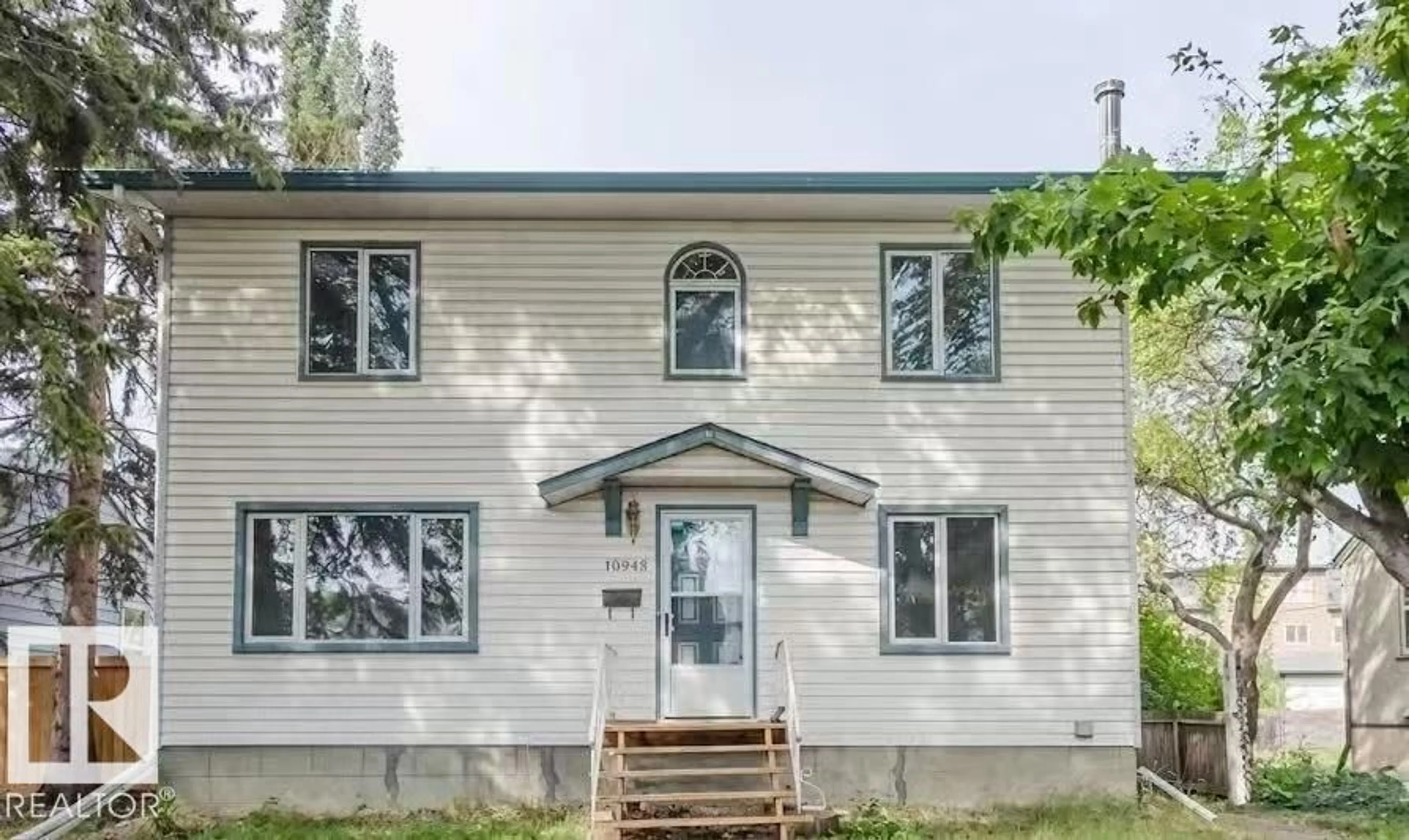 Home with vinyl exterior material, street for 10948 75 AV, Edmonton Alberta T6G0G9