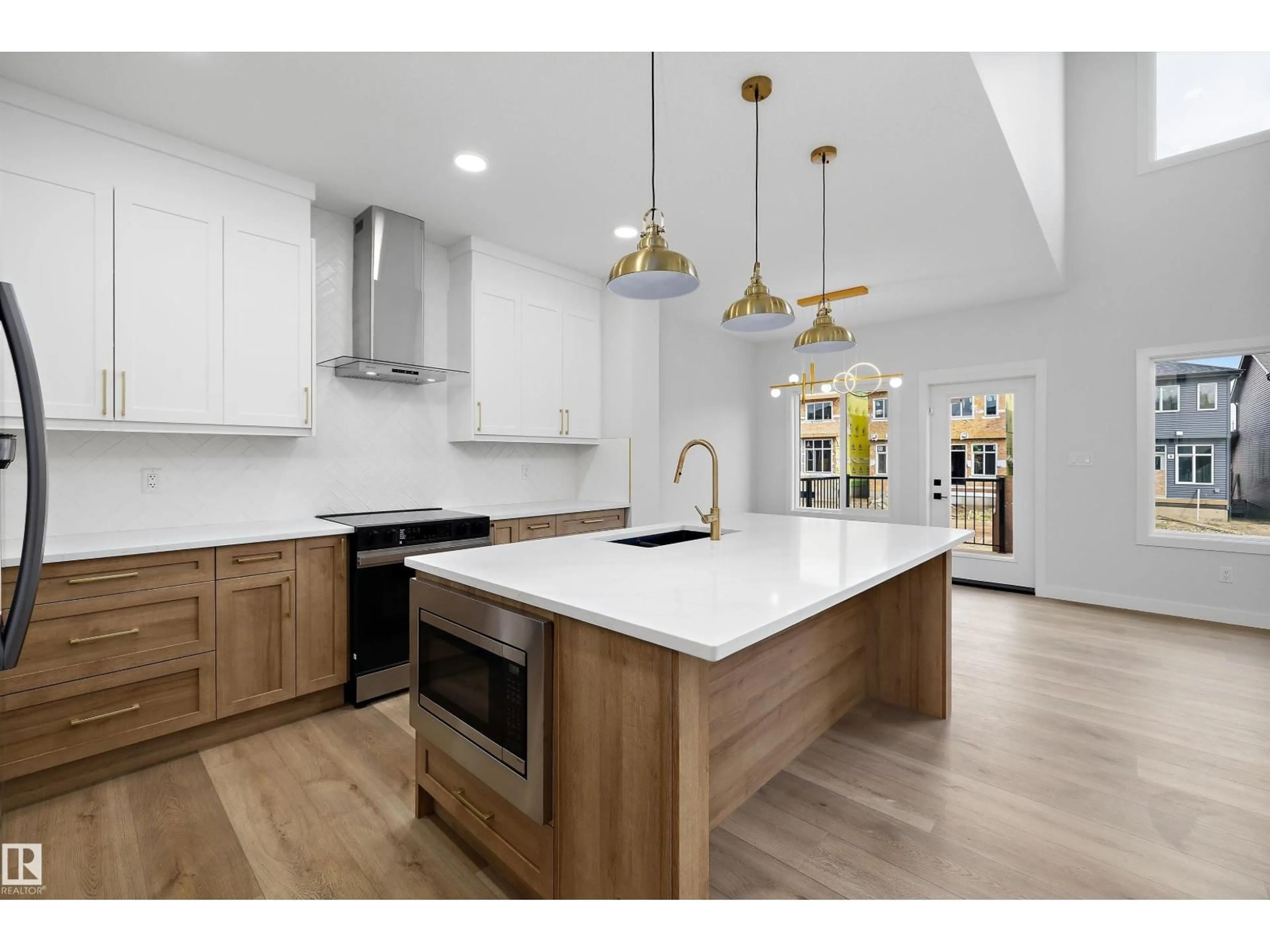 Open concept kitchen, wood/laminate floor for 1780 CROSSBILL LO, Edmonton Alberta T5S0Y4
