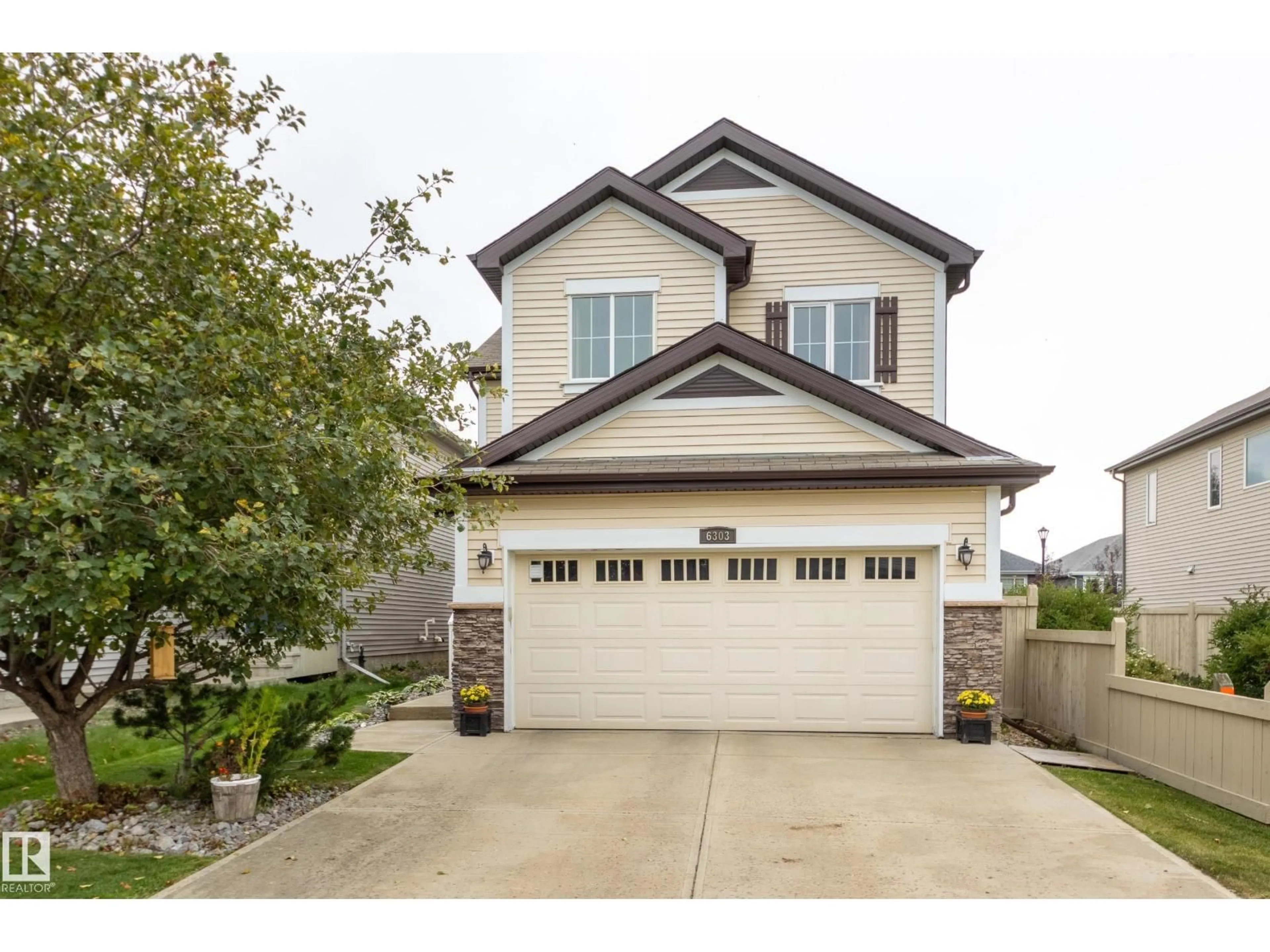 Home with vinyl exterior material, street for 6303 18 AV, Edmonton Alberta T6X0S1