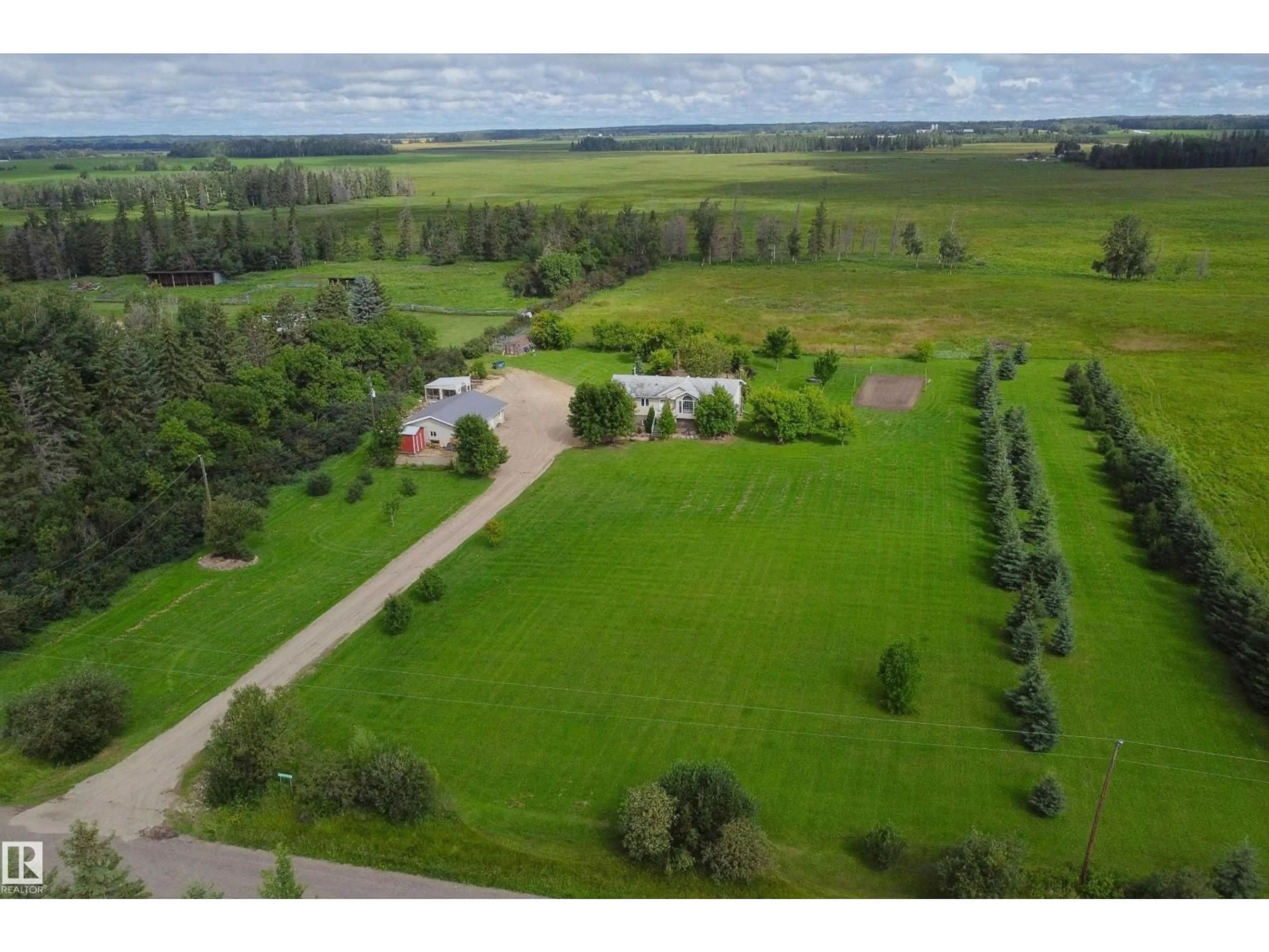 A pic from outside/outdoor area/front of a property/back of a property/a pic from drone, water/lake/river/ocean view for 6006 TWP RD 602, Rural Barrhead County Alberta T7N1N3