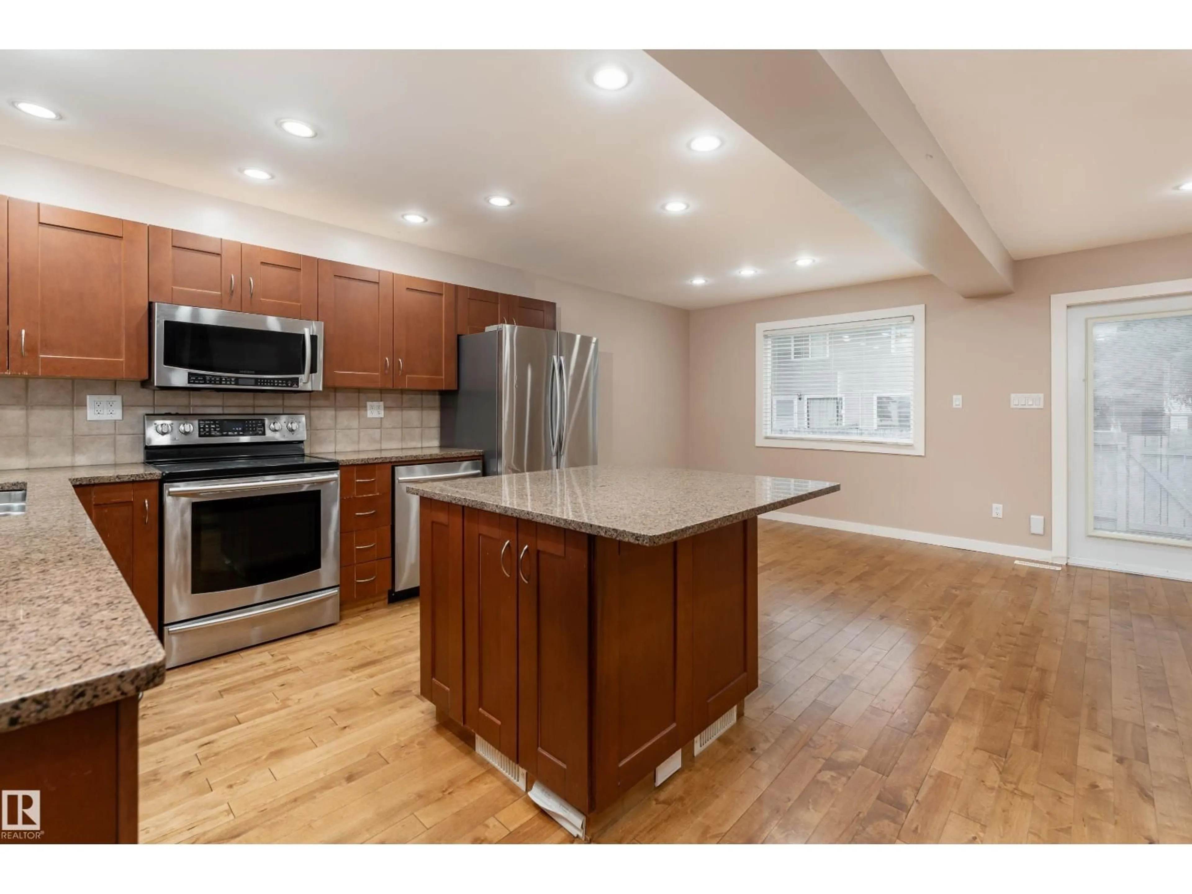 Open concept kitchen, wood/laminate floor for #28 - 1415 62 ST, Edmonton Alberta T6L4K1