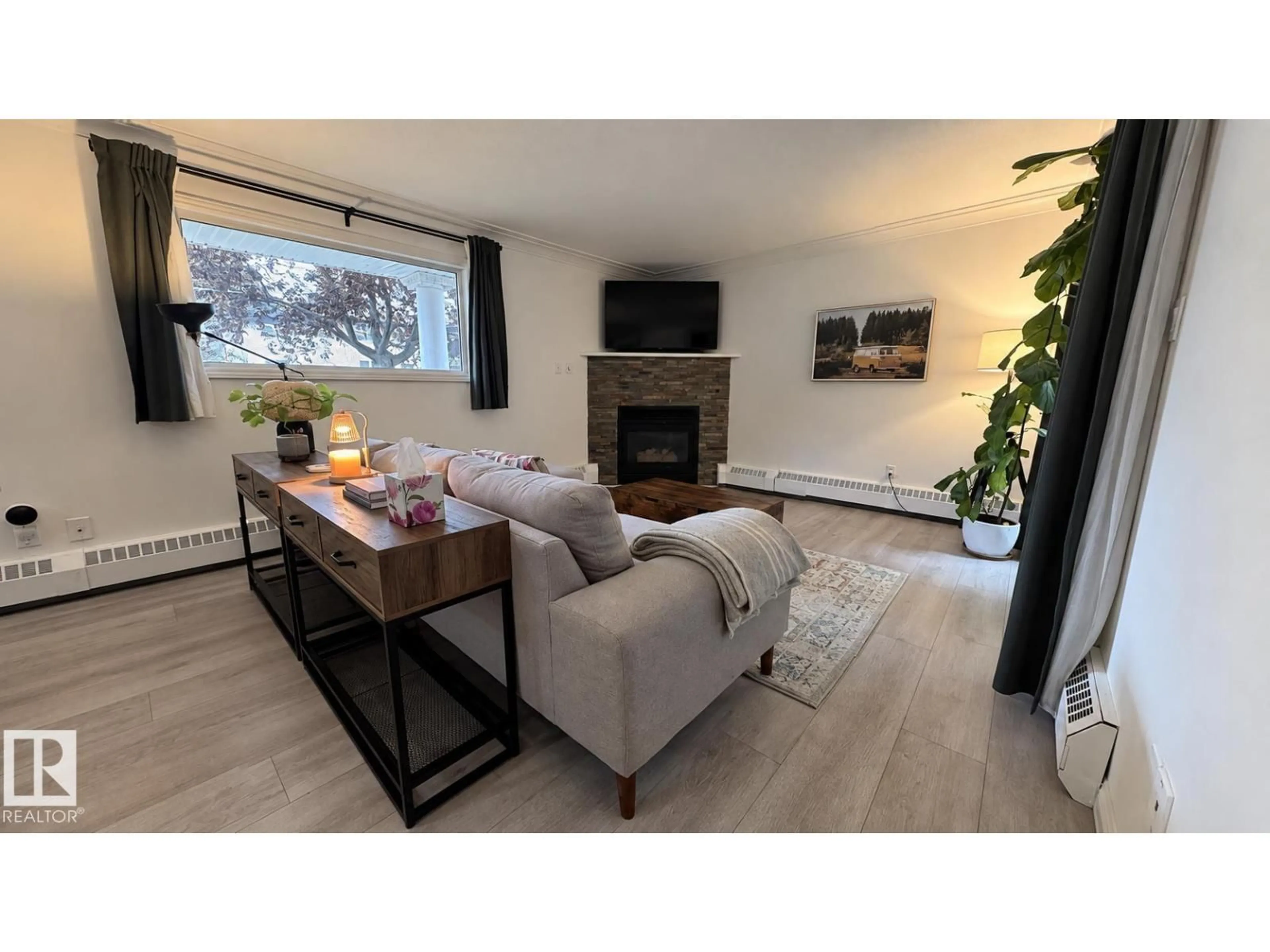 Living room with furniture, wood/laminate floor for #18 - 9926 80 AV, Edmonton Alberta T6E6L5