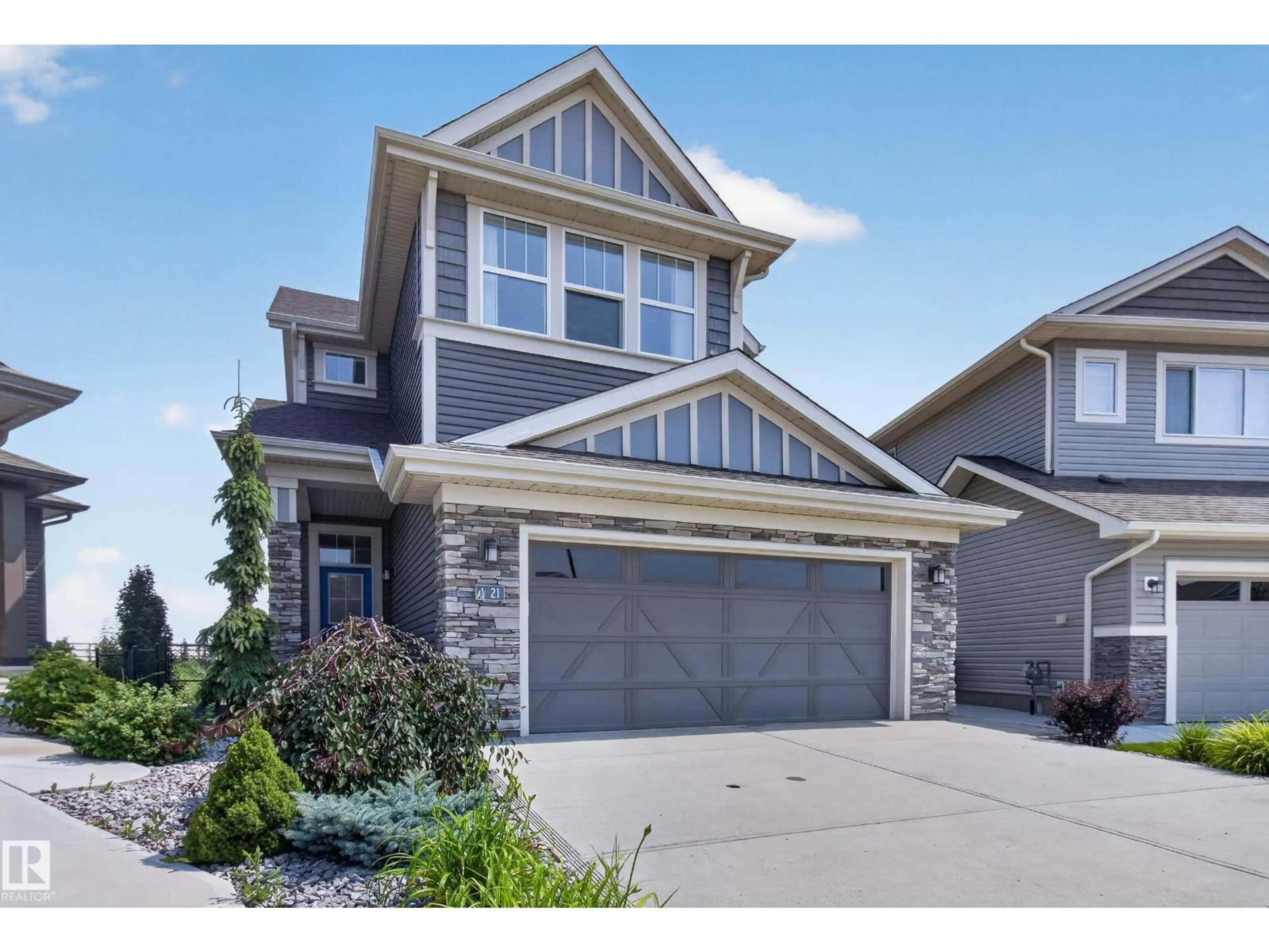 Home with vinyl exterior material, street for 21 SAPPHIRE CV, Sherwood Park Alberta T8H1Z8