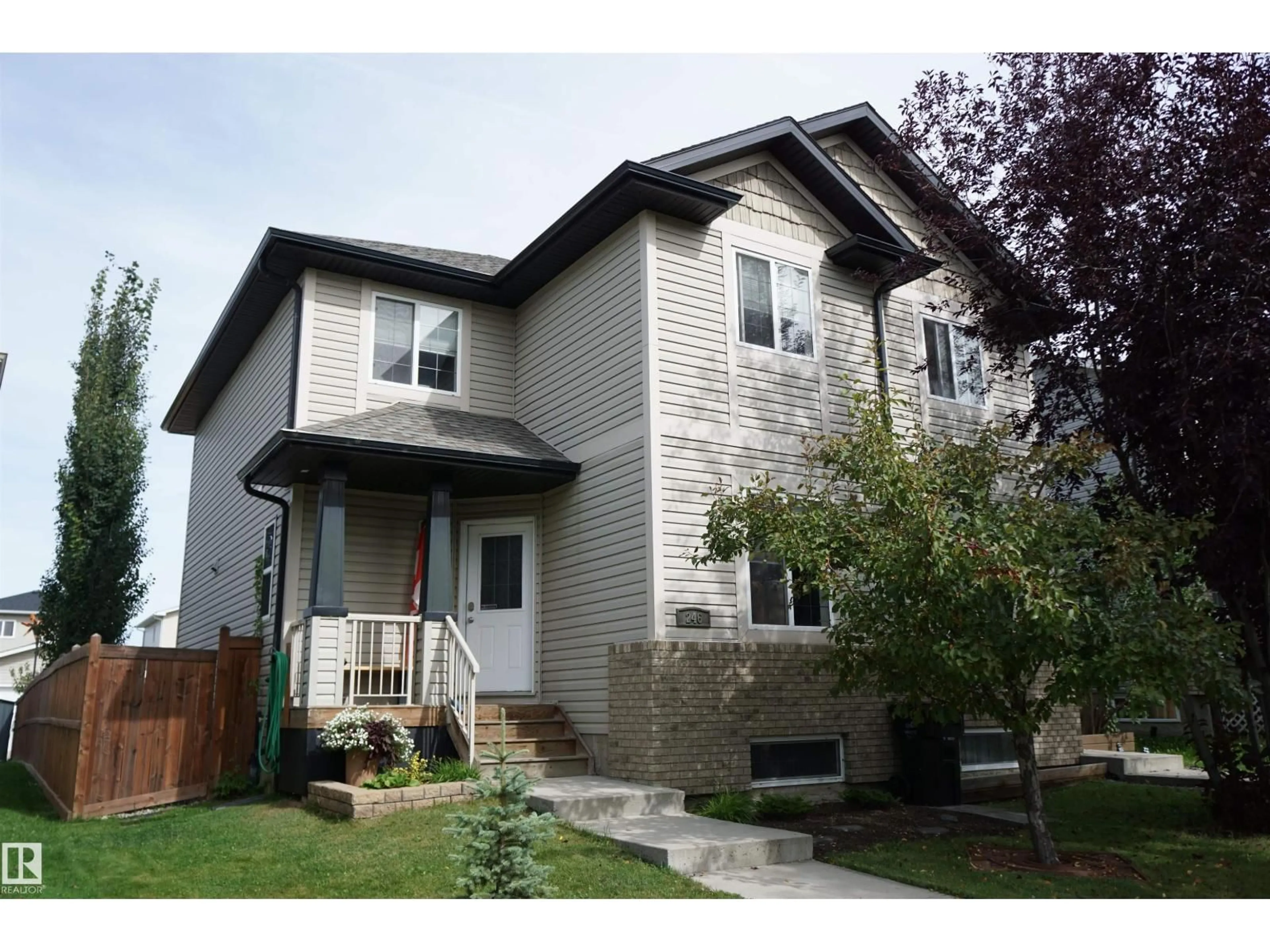 Home with vinyl exterior material, street for 246 AVENA CI, Leduc Alberta T9E0L8