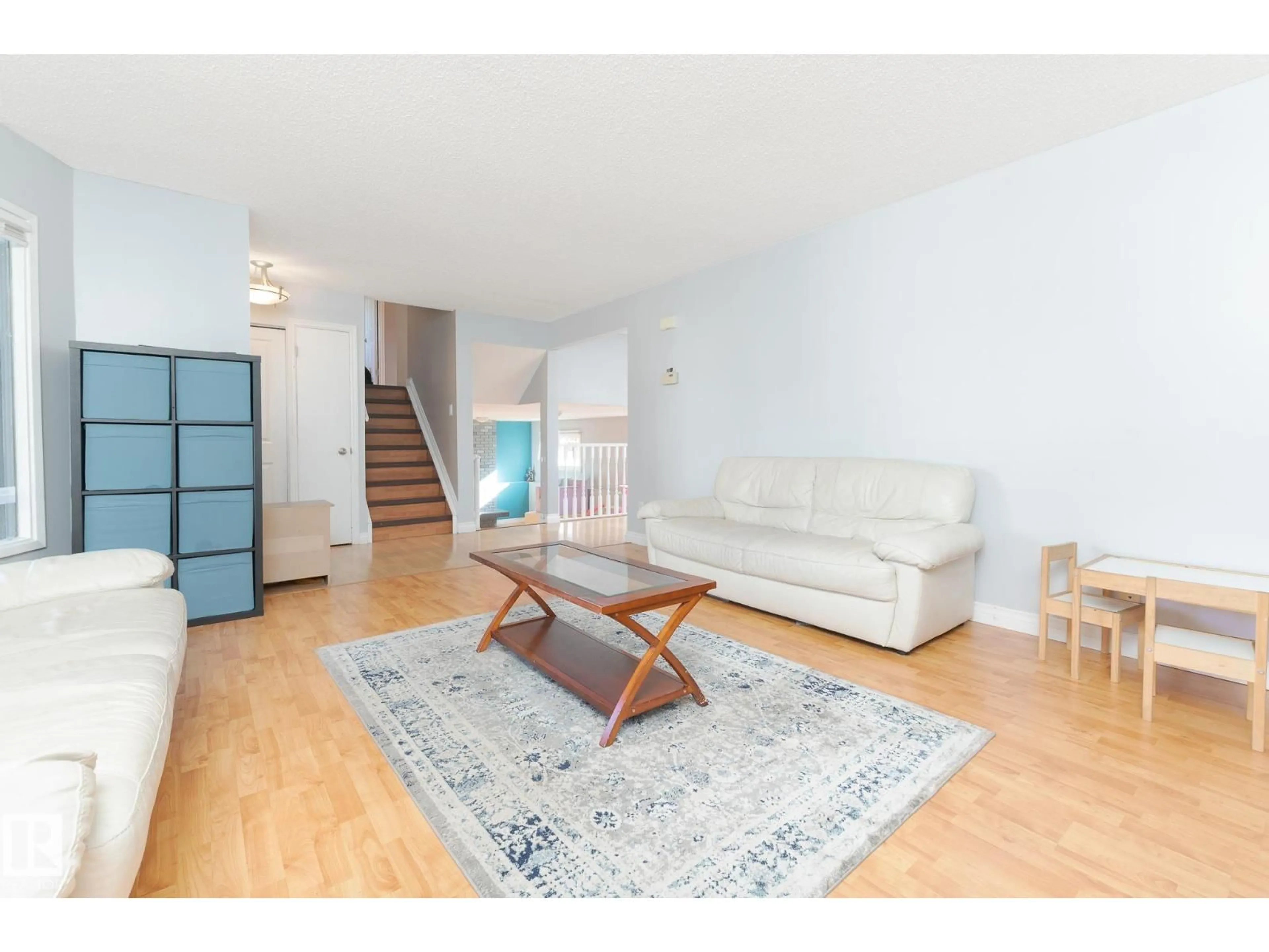Living room with furniture, wood/laminate floor for 11 OATWAY ST, Spruce Grove Alberta T7X2E5